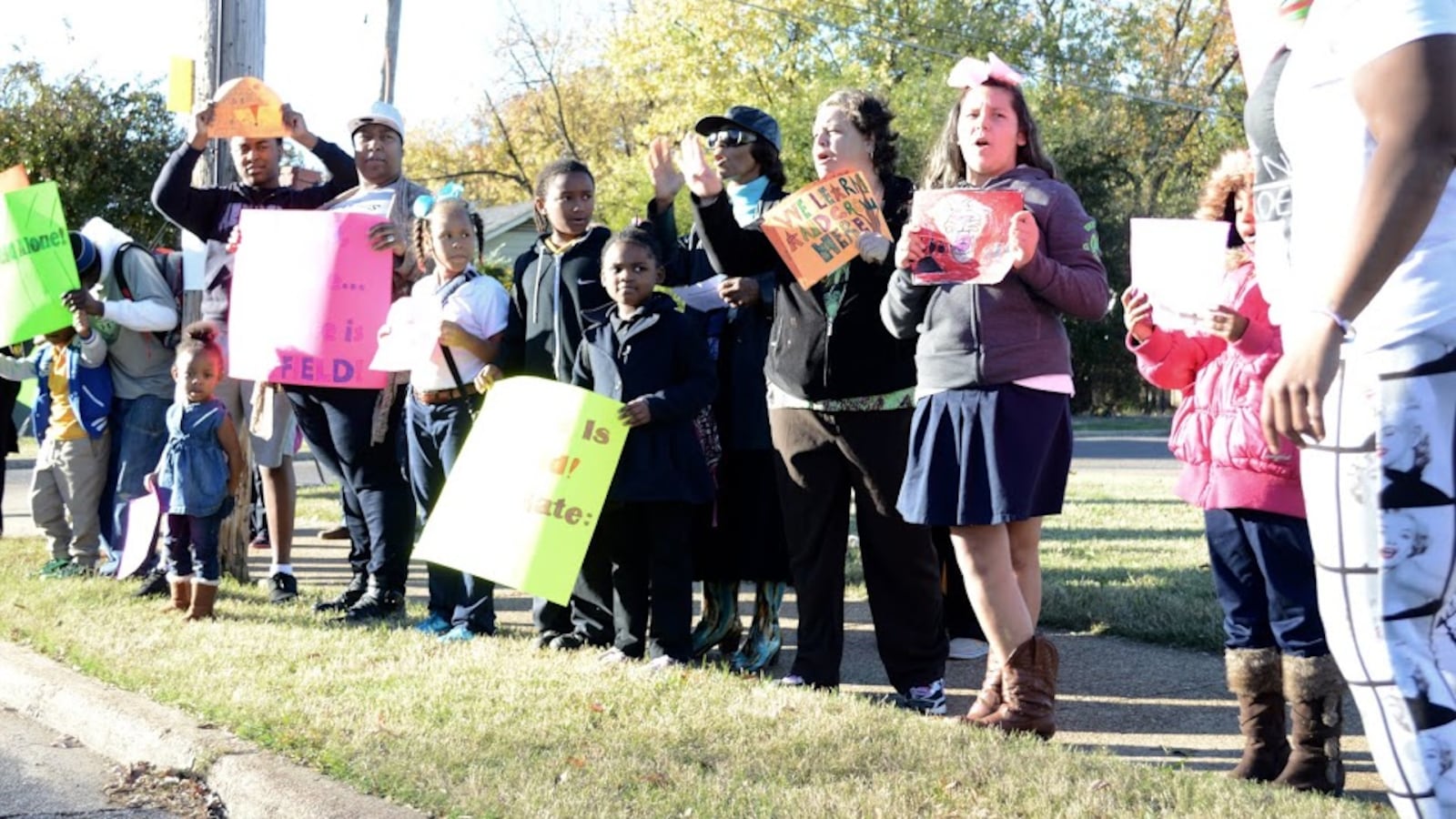 Students and parents line the street in November to protest the proposed takeover of Sheffield Elementary School by the Achievement School. The state-run district later removed the Memphis school from its takeover list for 2016-17.