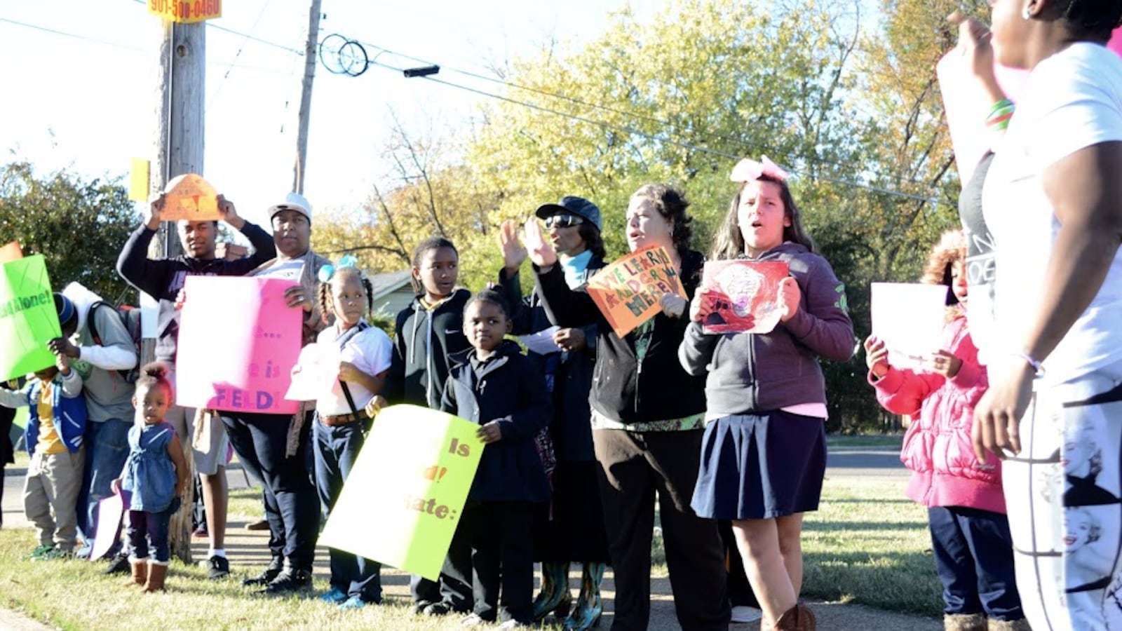 Students and parents line the street in November to protest the proposed takeover of Sheffield Elementary School by the Achievement School. The state-run district later removed the Memphis school from its takeover list for 2016-17.