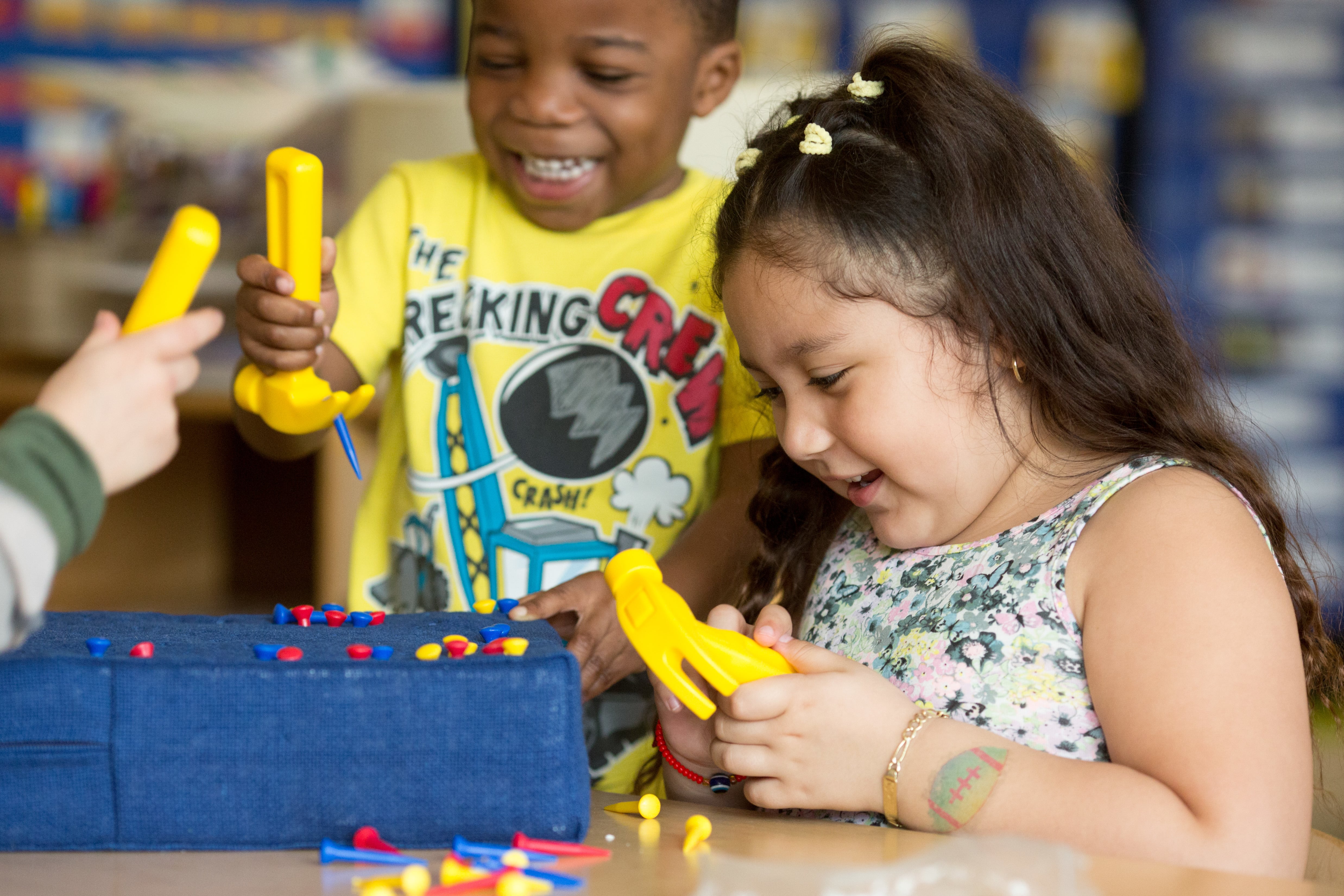Two children playing in a child care facility.