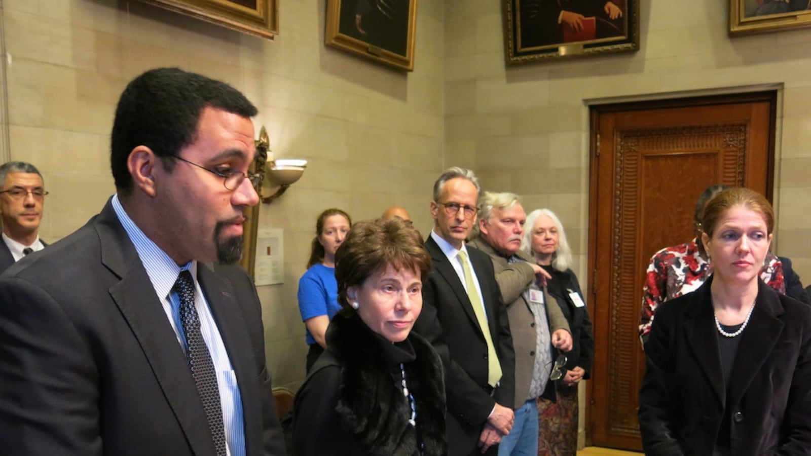 Former commissioner John King and Chancellor Merryl Tisch stand with Beth Berlin, right.