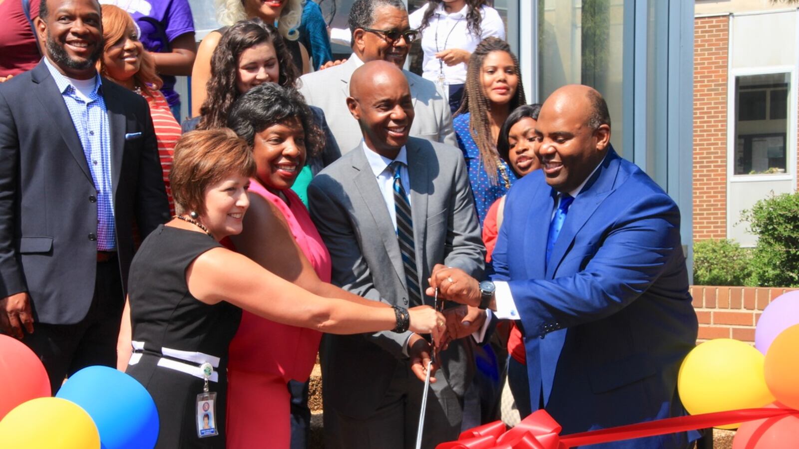 Superintendent Dorsey Hopson (center) joins school board members and teachers to unveil the district’s new Teacher Tool Box.