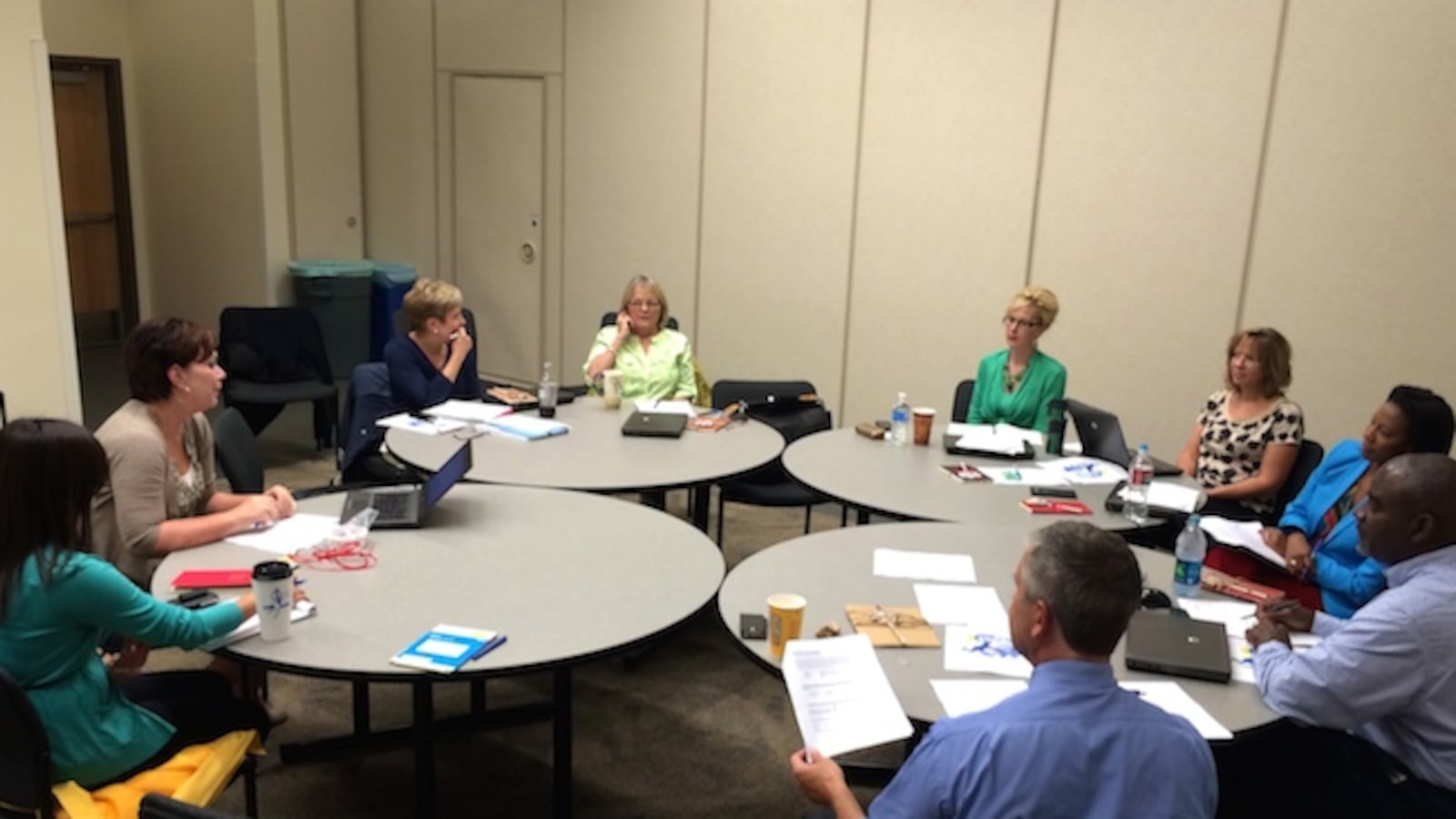 Aurora Public Schools administrators met last month to discuss among other topics how the district's new P-20 Learning Community support teams can help on the first day of school. Andre Wright, a P-20 director, told the room they needed to show up and "serve."