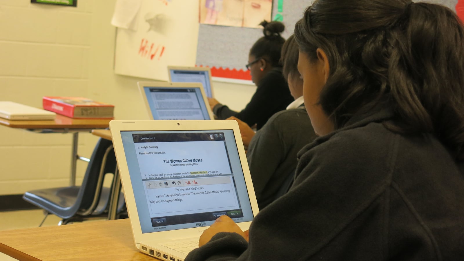 Colonial Middle School eighth graders practice taking the writing assessment online.