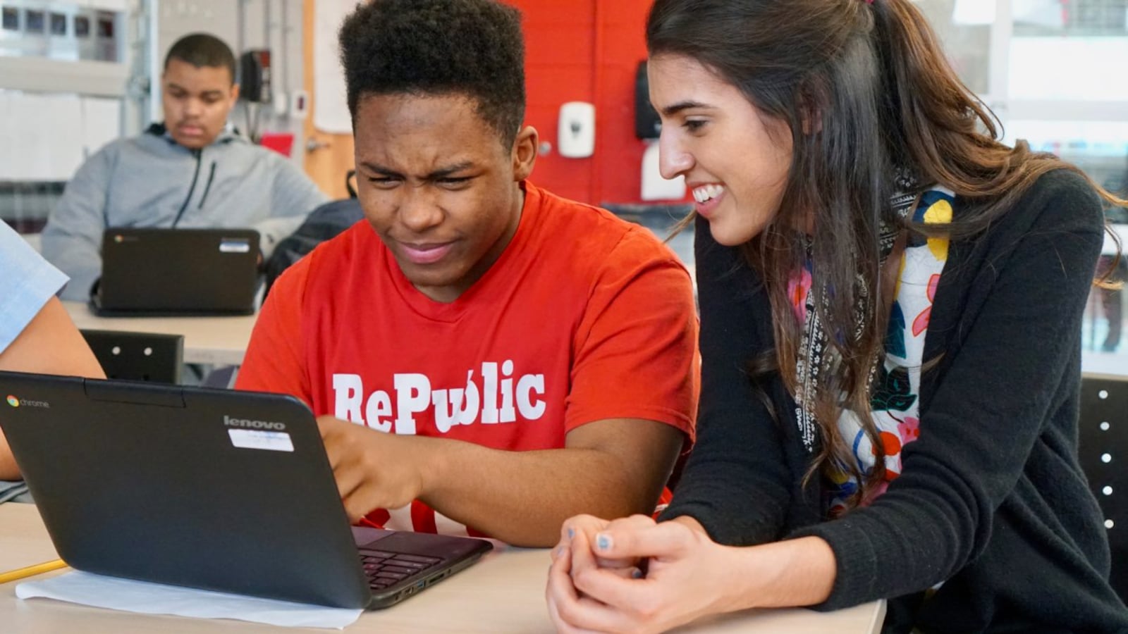 Mehreen Butt (right) works with a student during an AP Computer Science Principles class.