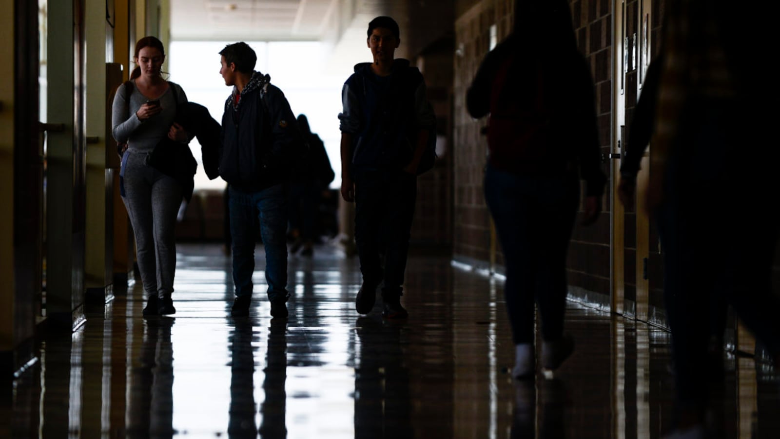 Students walk through the hall at Adams City High School between classes Monday, Feb. 4, 2019.