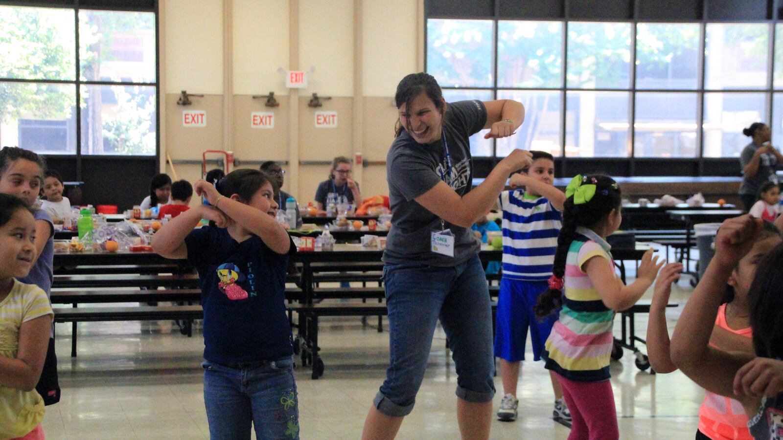Students and teachers dance together after lunch at a Memphis Teacher Residency Camp held this summer at Kingsbury Elementary School.