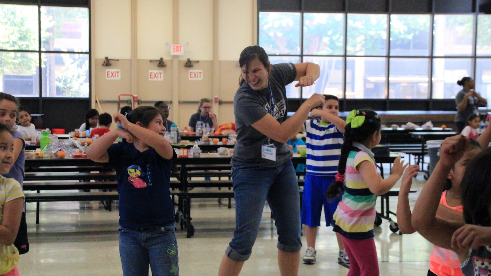 Students and teachers dance together after lunch at a Memphis Teacher Residency Camp held this summer at Kingsbury Elementary School.