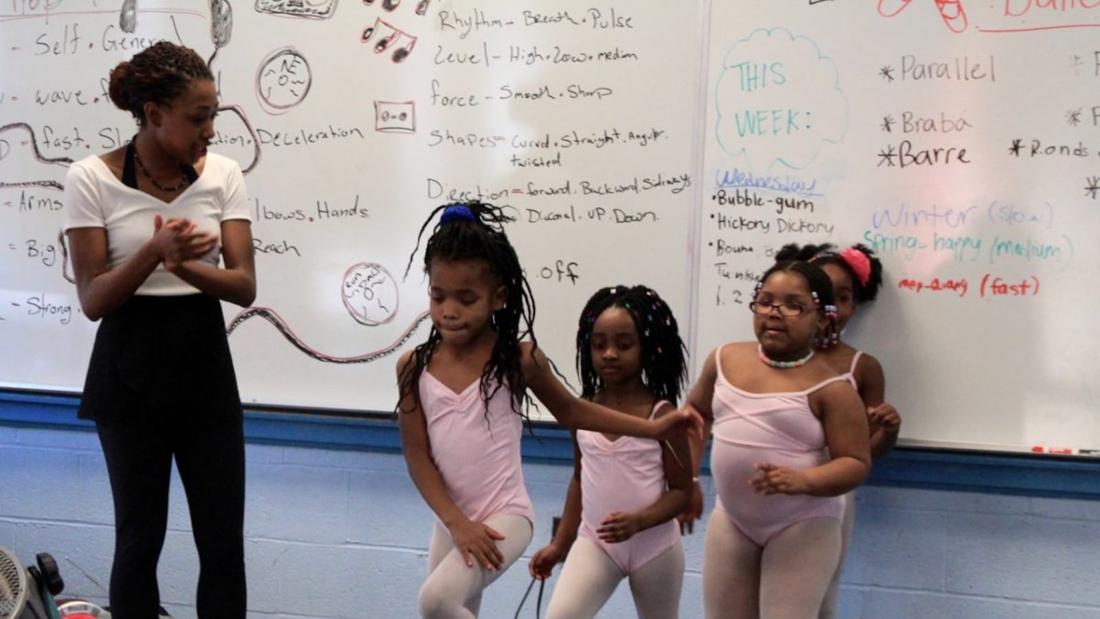 Briana Brown, an instructor with New Ballet Ensemble, prepares her first-grade dance students for a performance at Dunbar Elementary School in Memphis.