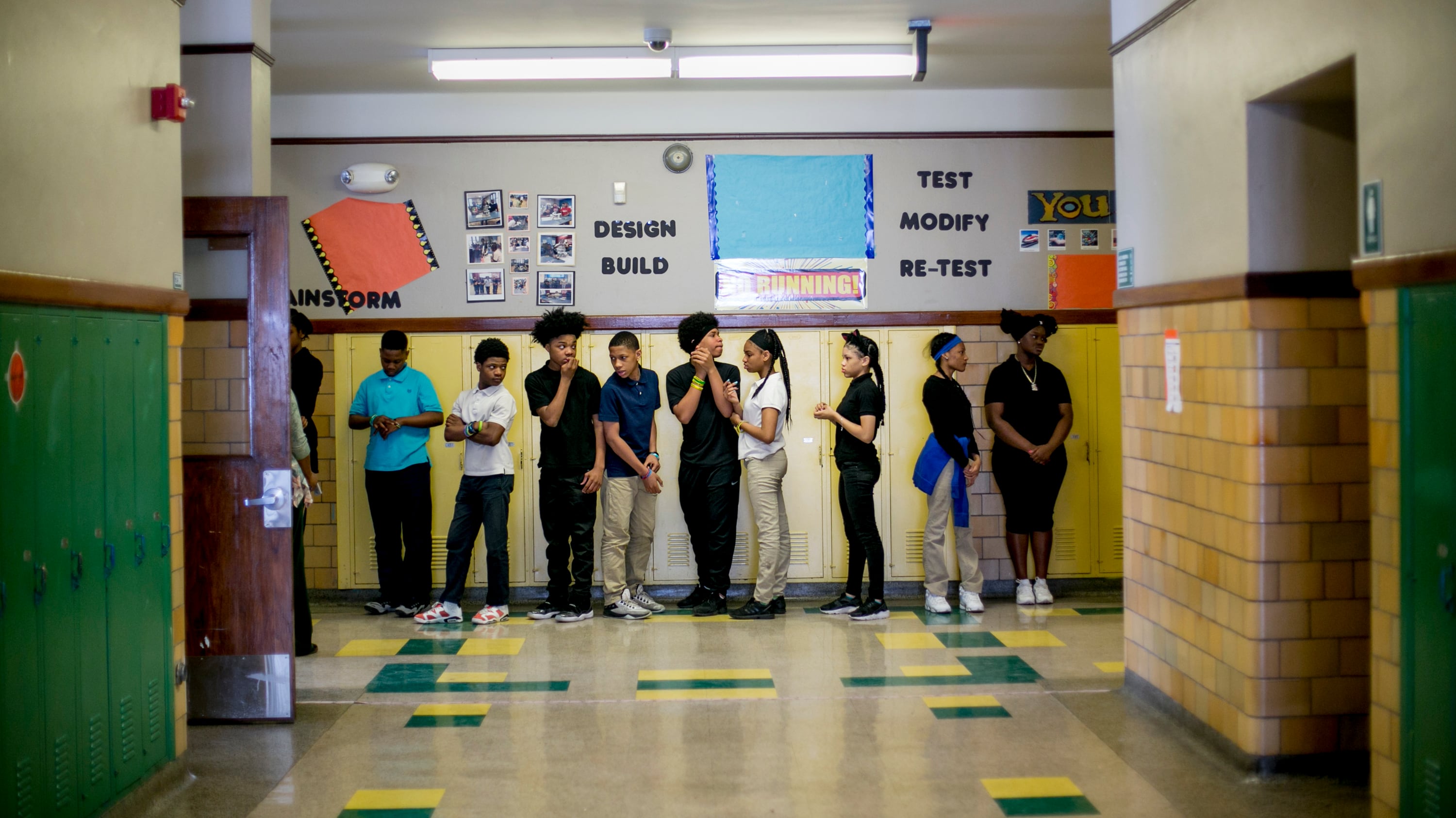 The students of Bethune Elementary-Middle School’s homeroom 8B line up to go to lunch. Collectively, 31 students in the class attended 128 schools by the time they reached eighth grade.