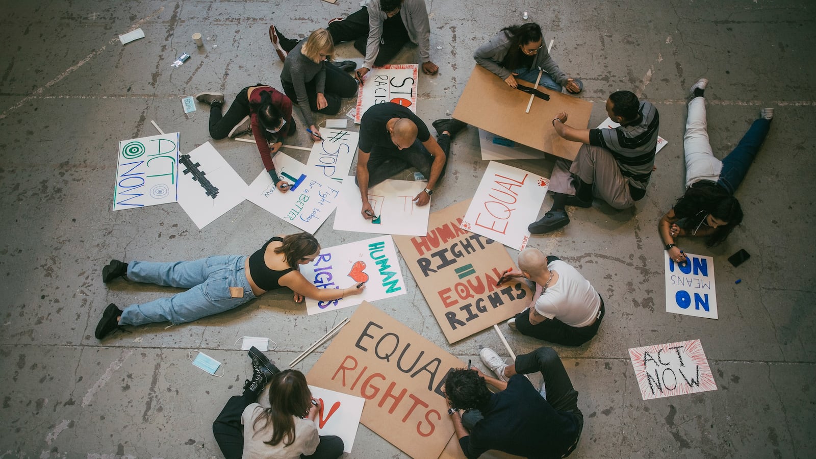 Young people make signs for equal rights and human rights.