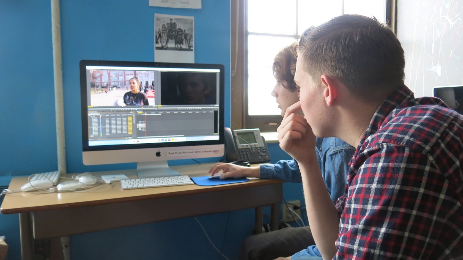 Students at East view footage from the protest at their school