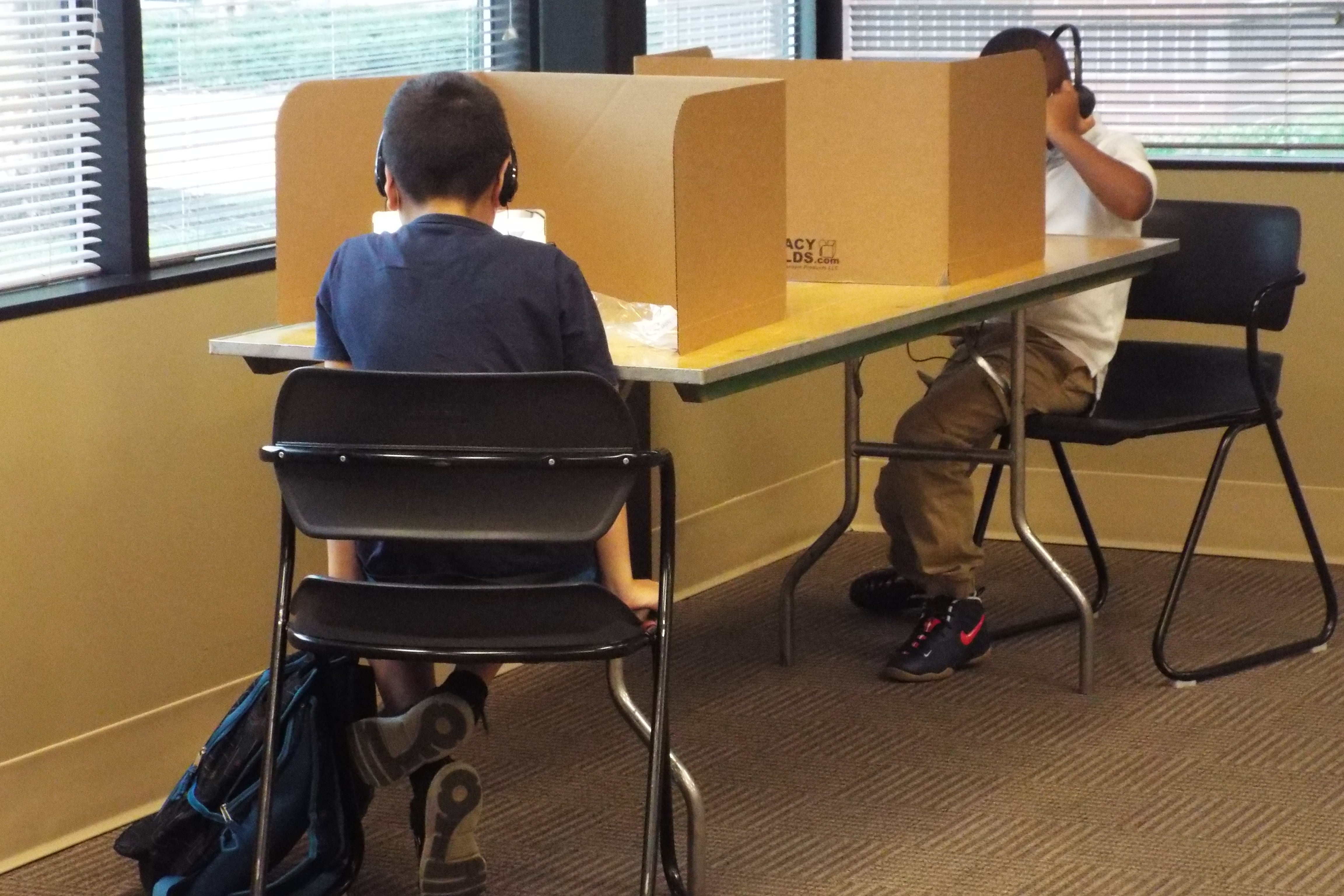 Shelby County Schools students log in remotely from the YMCA’s virtual learning center in Cordova on the first day of school.