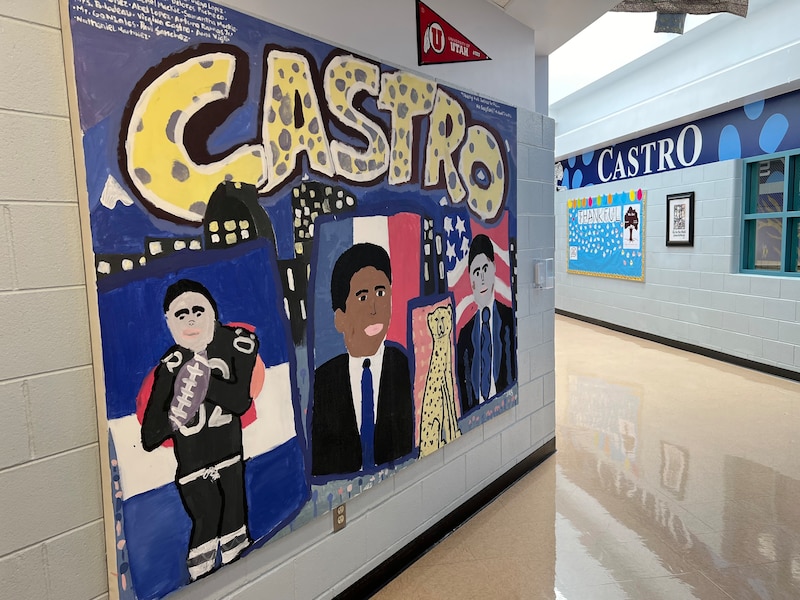 A mural on the side of a school hallway.