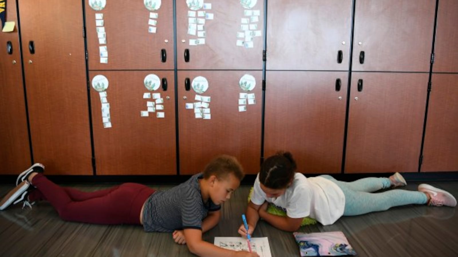 Finley Checa, left, and Ava Weeden, both 11, work on a project in their science class at Denver Green School Northfield.