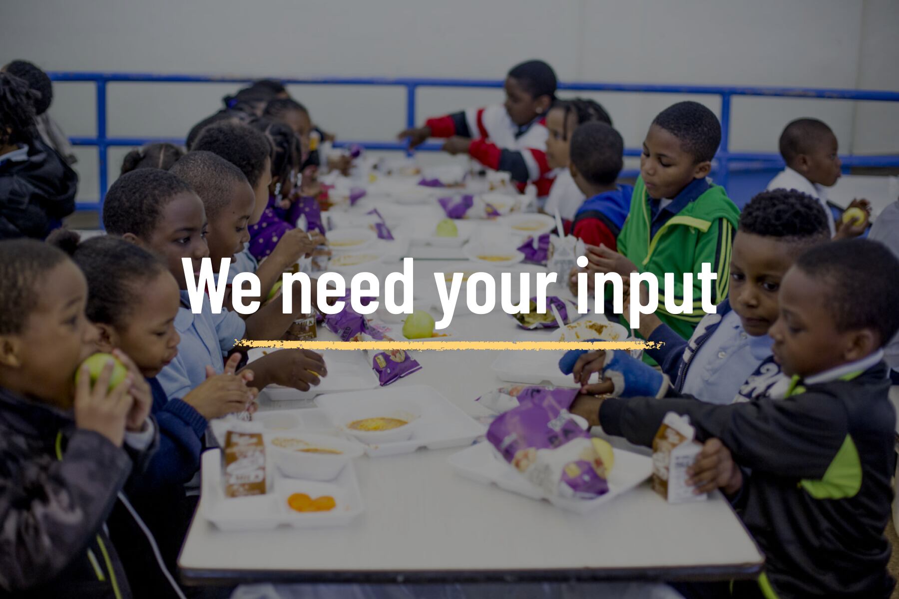 This Chalkbeat callout shows children eating lunch at a long table in Detroit.