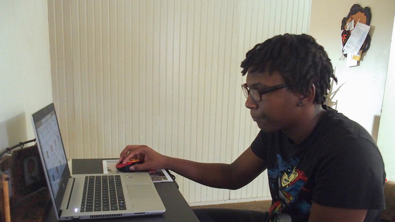 Jalan Clemmons working on his laptop computer at home.