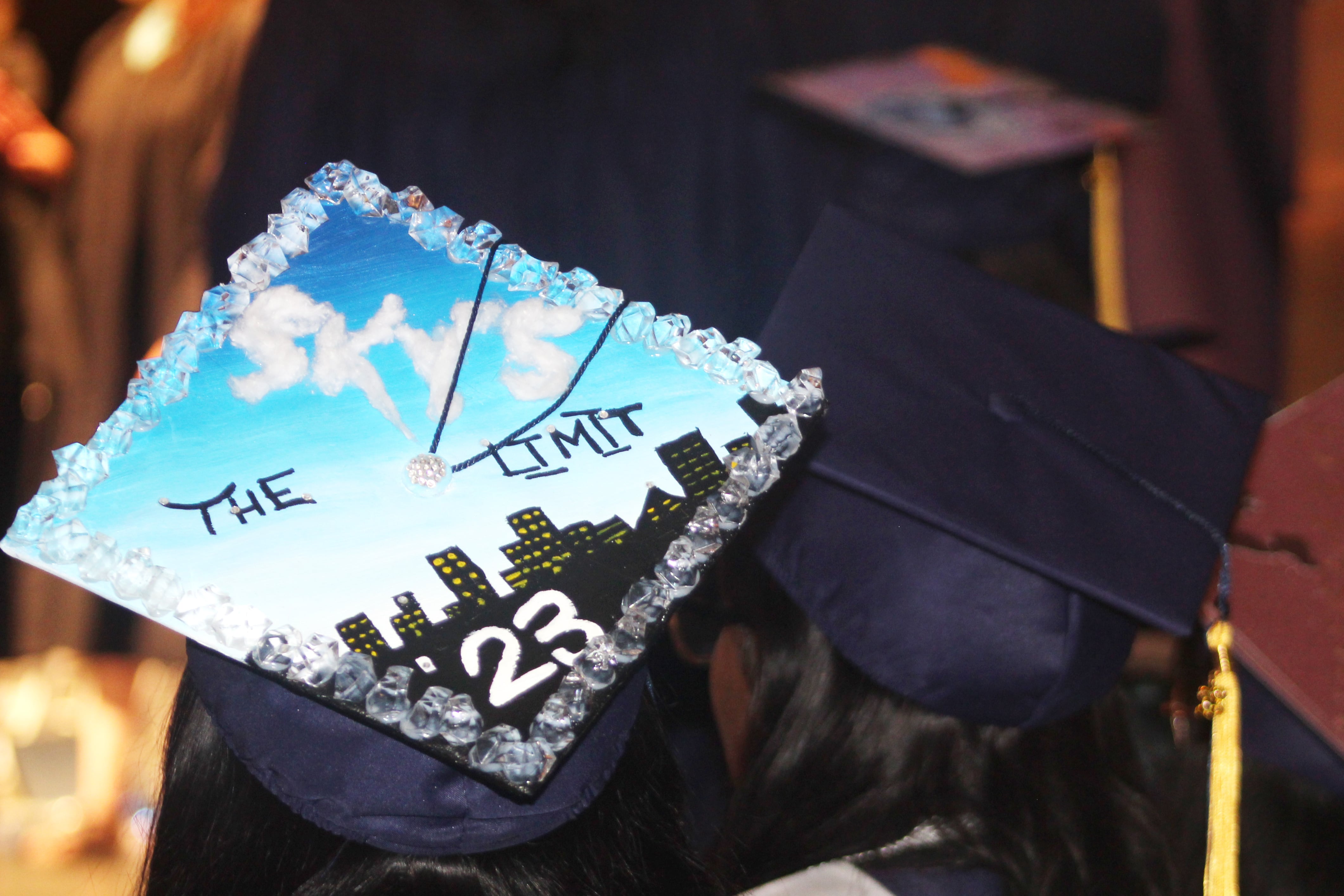 A graduate decorates his/her cap