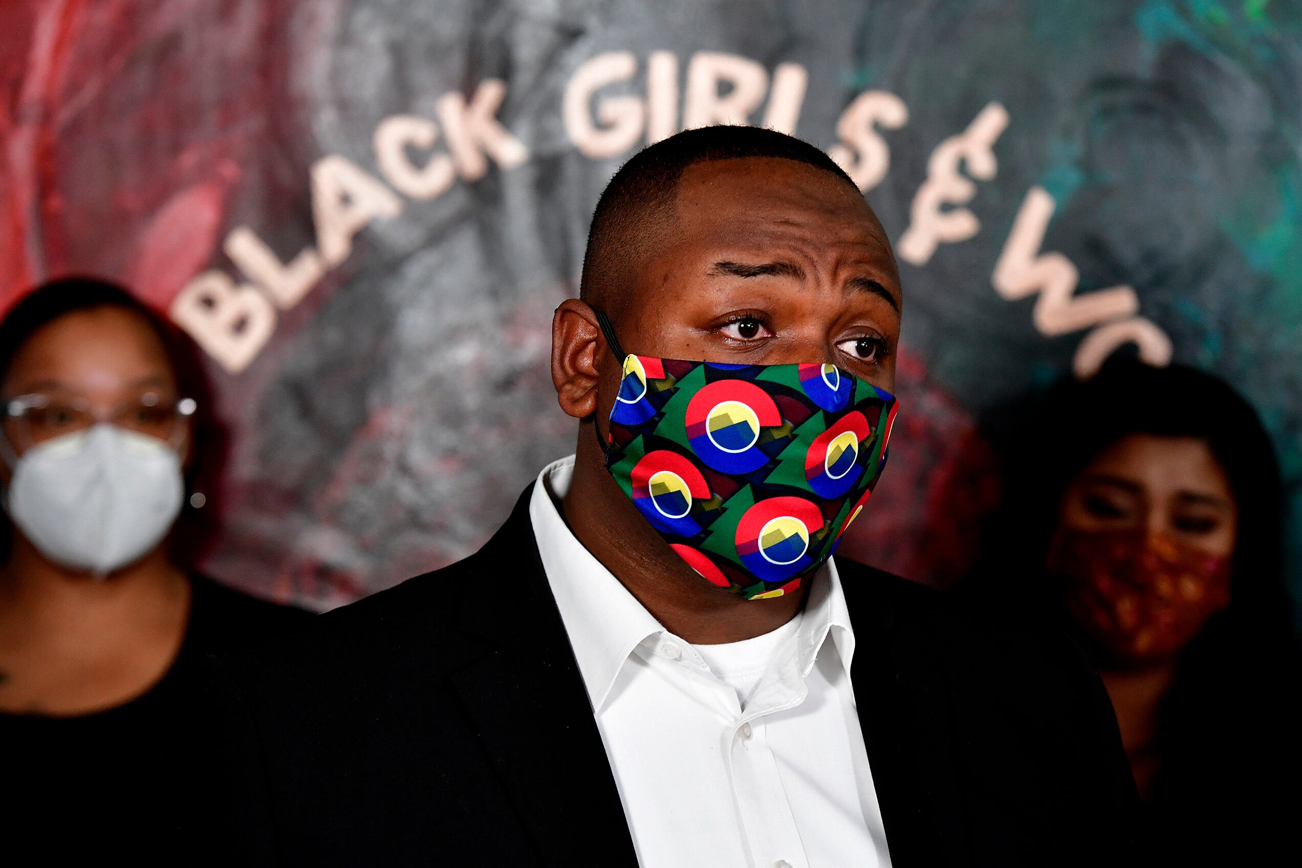 Tay Anderson, wearing a mask, is seen from the shoulders up.