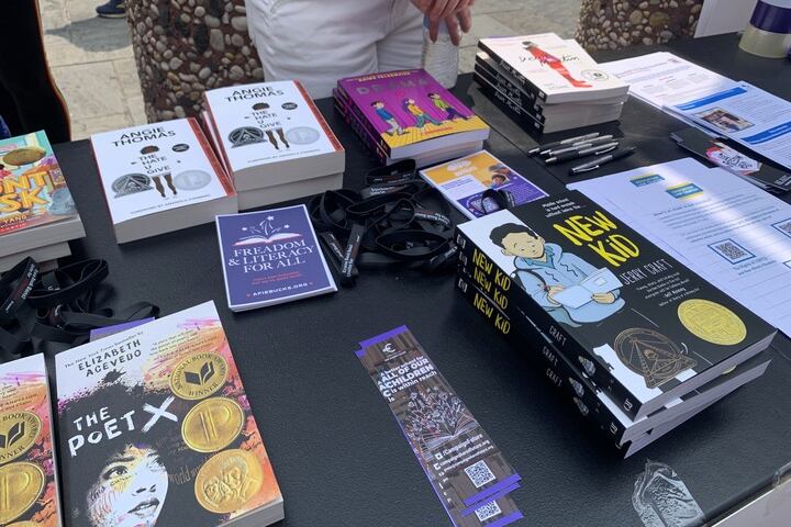 Stacks of books on a black tablecloth