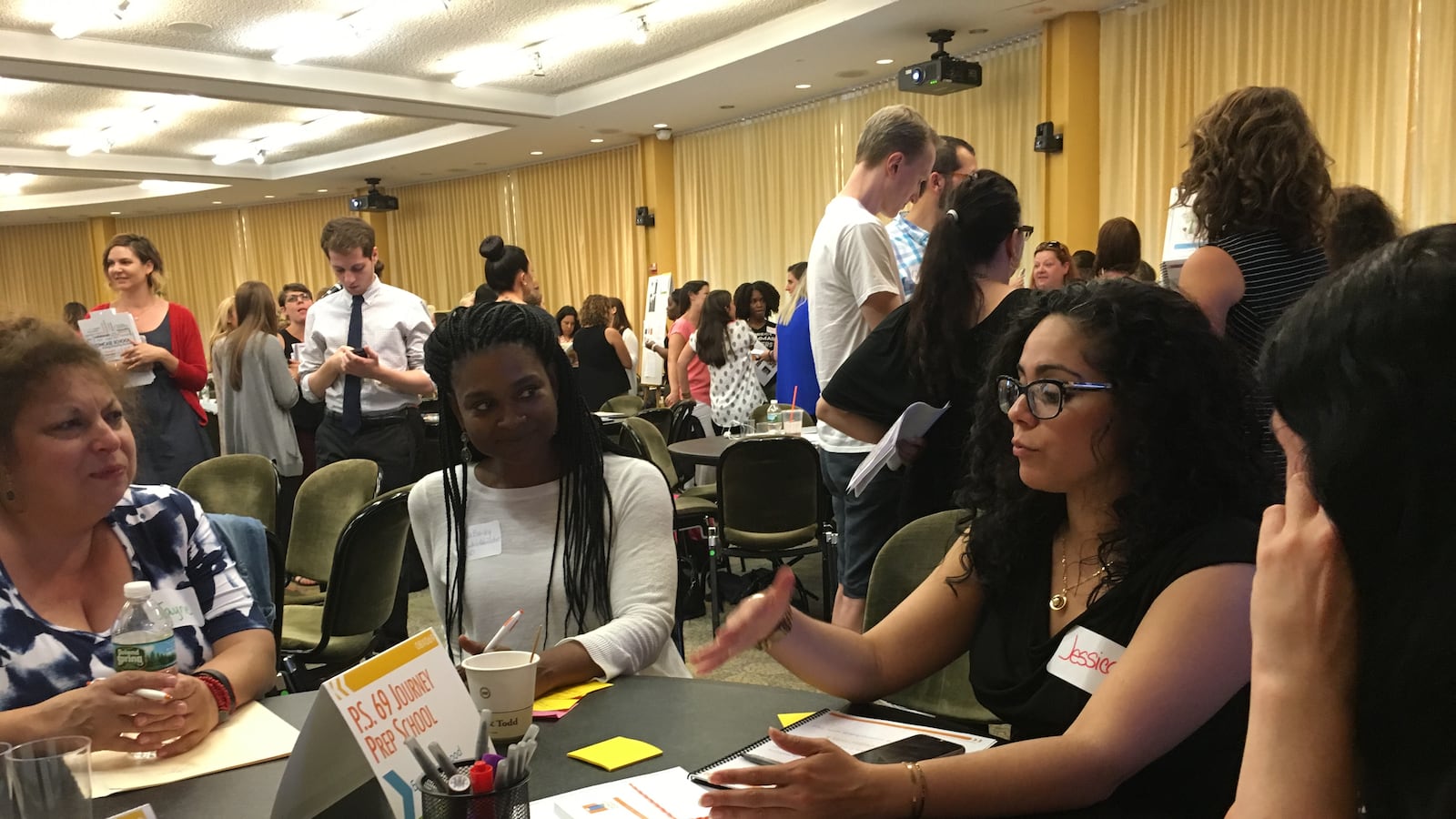 P.S. 154 Assistant Principal Jessica Cruz chats with other educators at a Monday event for the city's Showcase Schools.