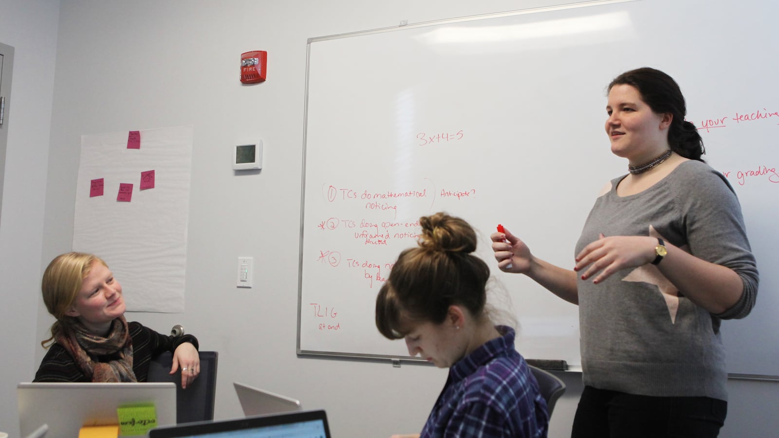 Alex Trunnell collaborates with two other teaching "design fellows" at the Woodrow Wilson Academy of Teaching and Learning.