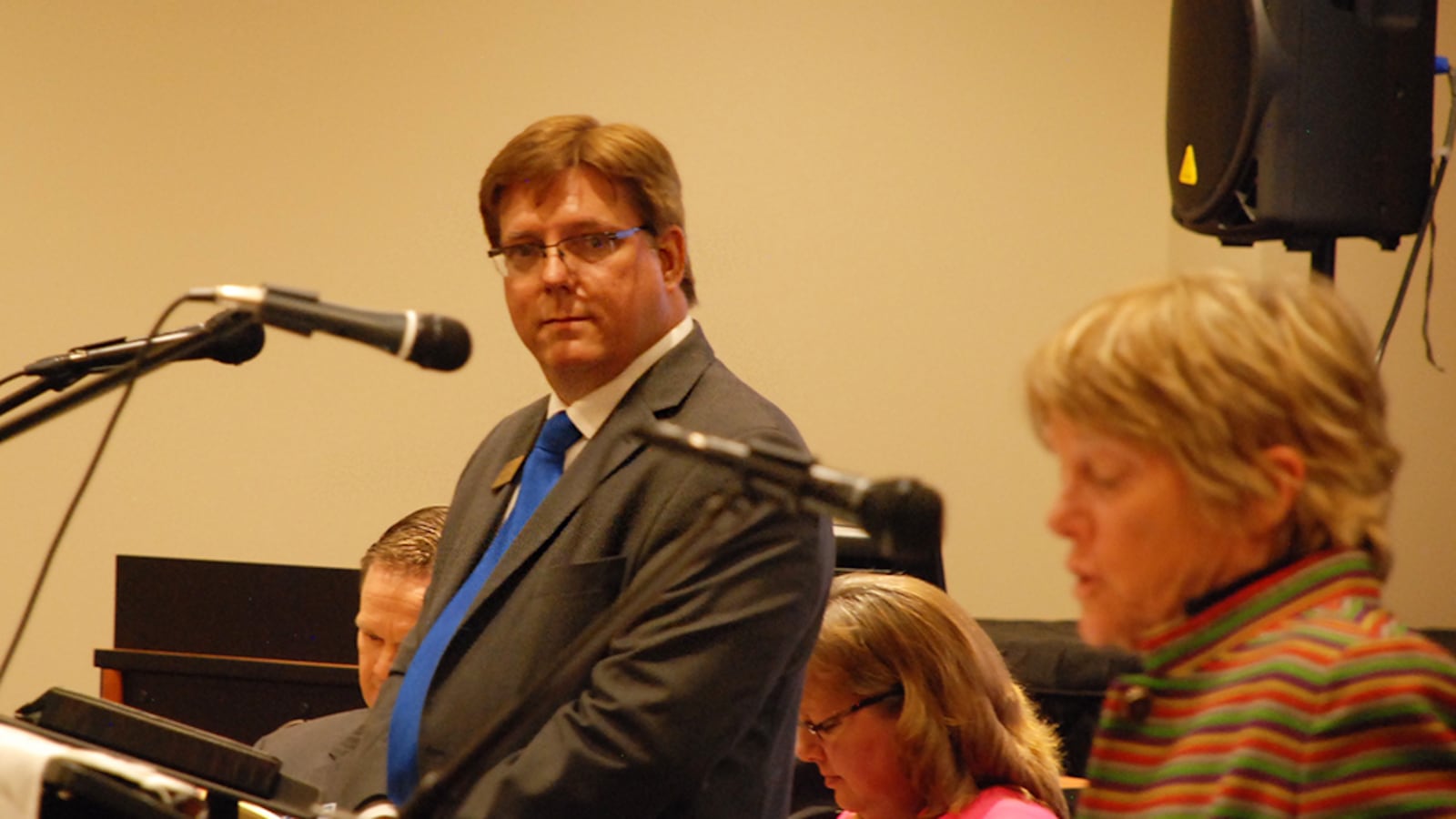 Jefferson County school board president Ken Witt, left, listens to former school board member Paula Noonan at the first school board candidate forum of the 2015 Election. Noonan is running to replace Witt, who is subject to a recall election in November