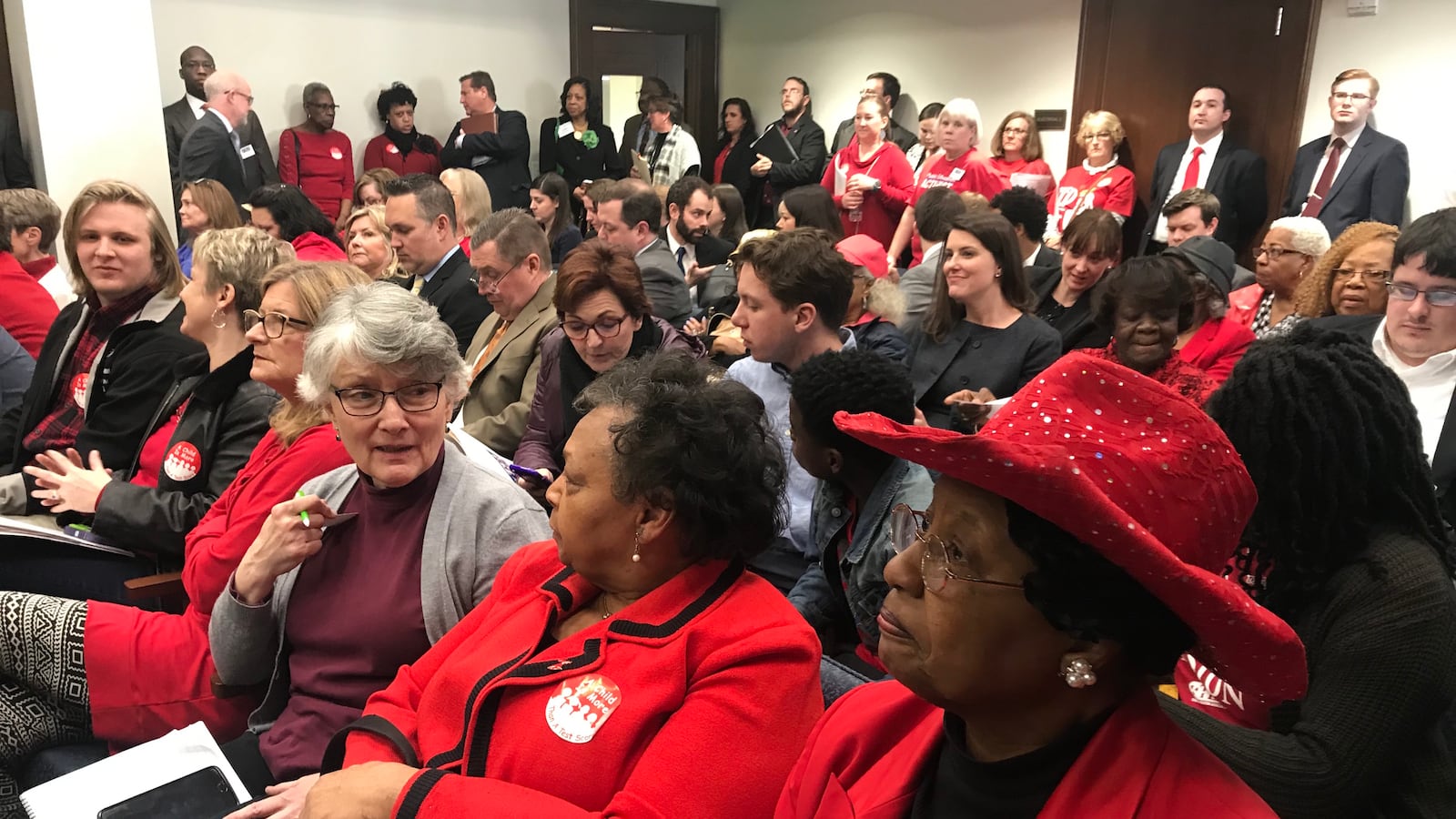 Educators wearing red pack the committee room where lawmakers considered legislation Tuesday that would create an education savings account program in Tennessee.
