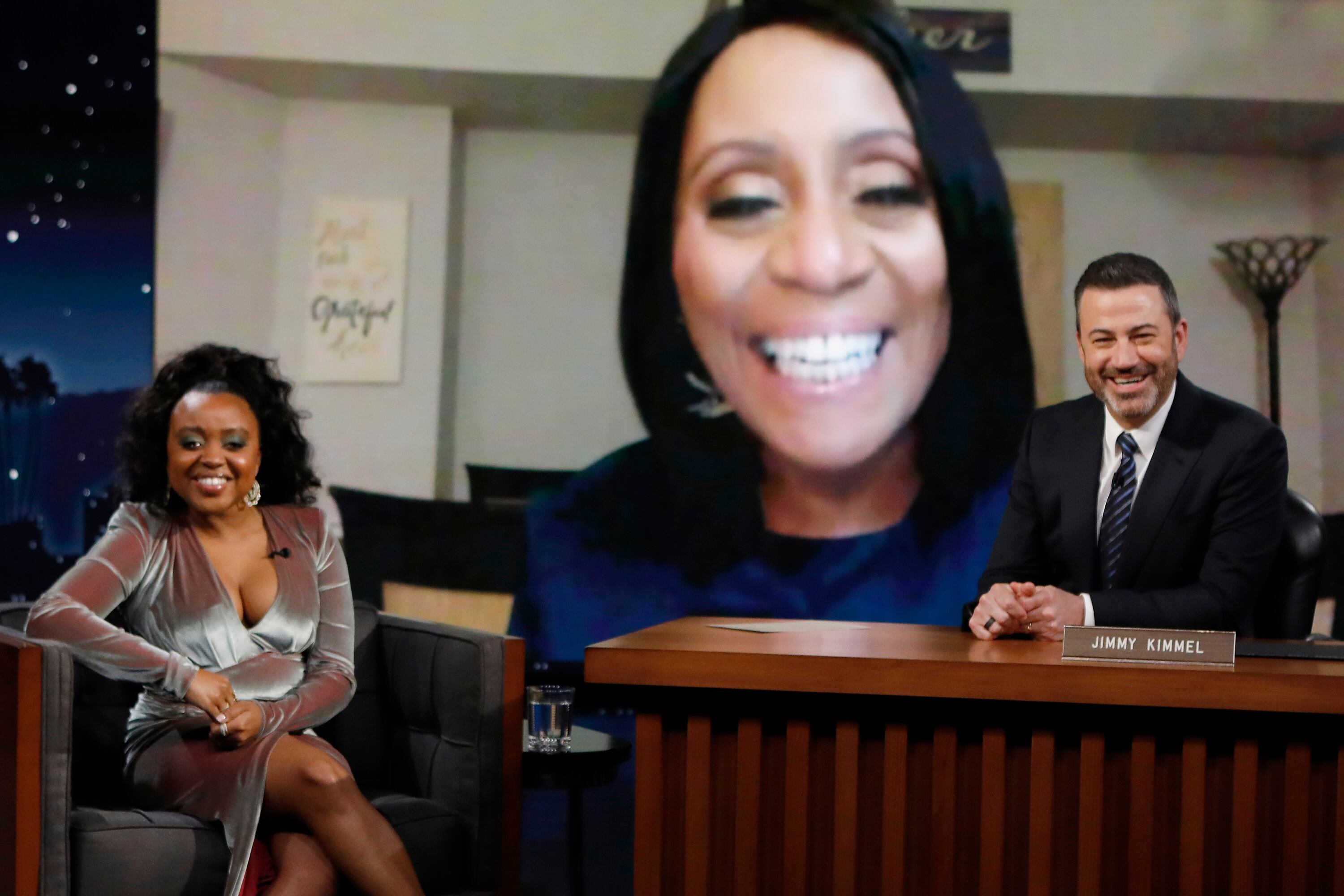Jimmy Kimmel, right, surprises Quinta Brunson with her former teacher Joyce Abbott, who appeared on a screen behind her.