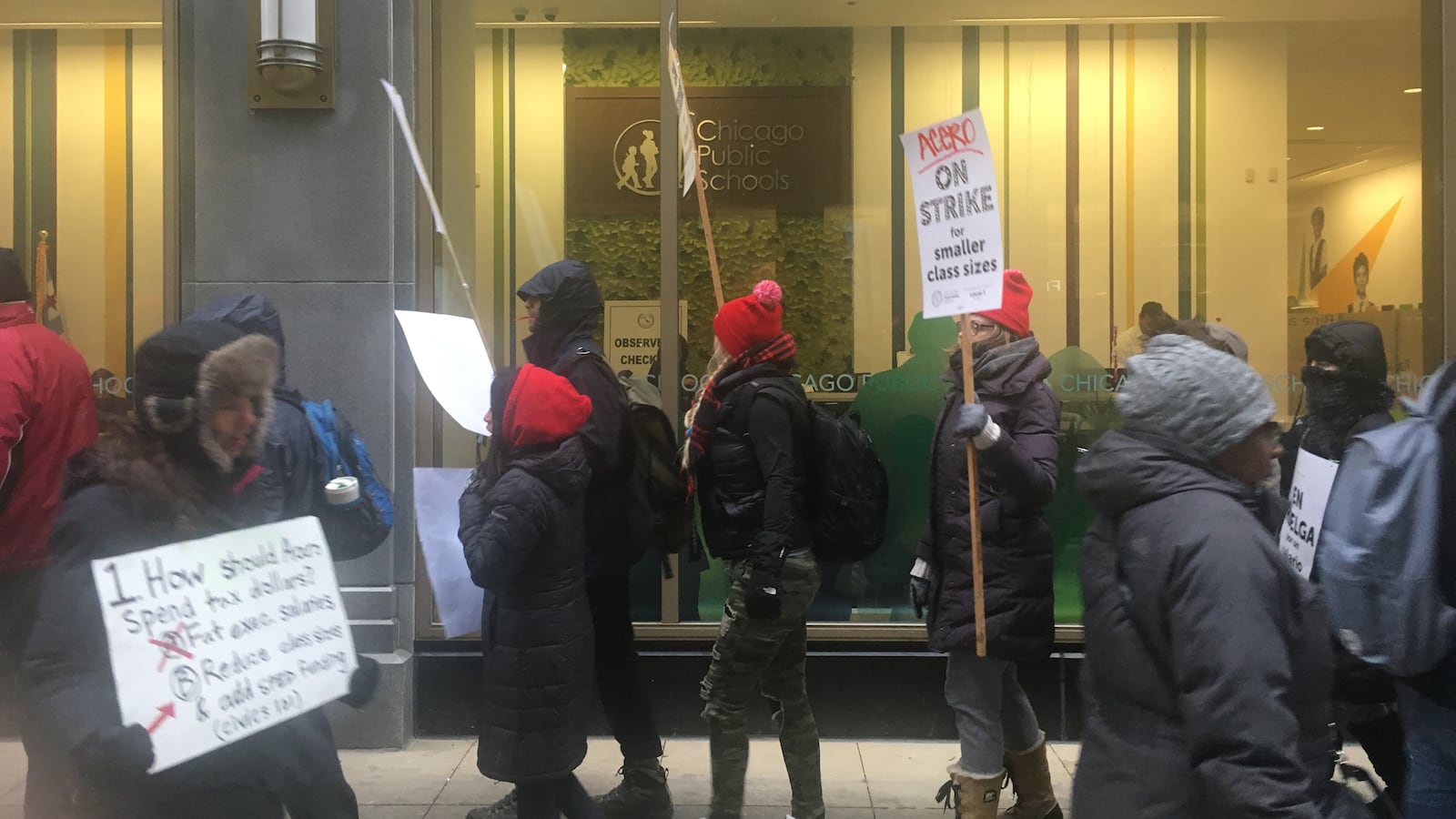 Striking Acero teachers walked a picket line in front of a Chicago Board of Education meeting on Wednesday.
