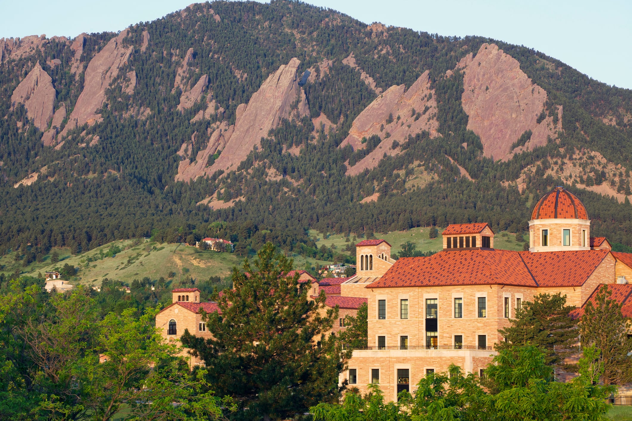 The Flatirons behind a classroom building on the University of Colorado campus in Boulder Colorado.