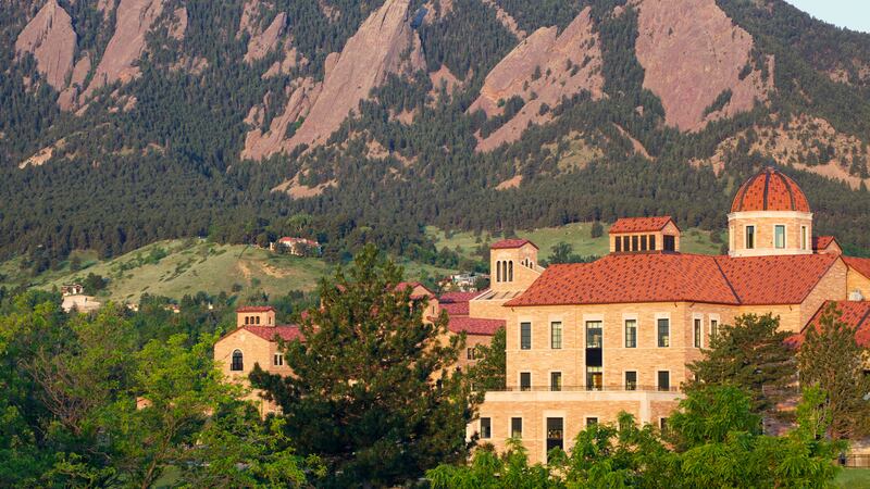 The Flatirons behind a classroom building on the University of Colorado campus in Boulder Colorado.