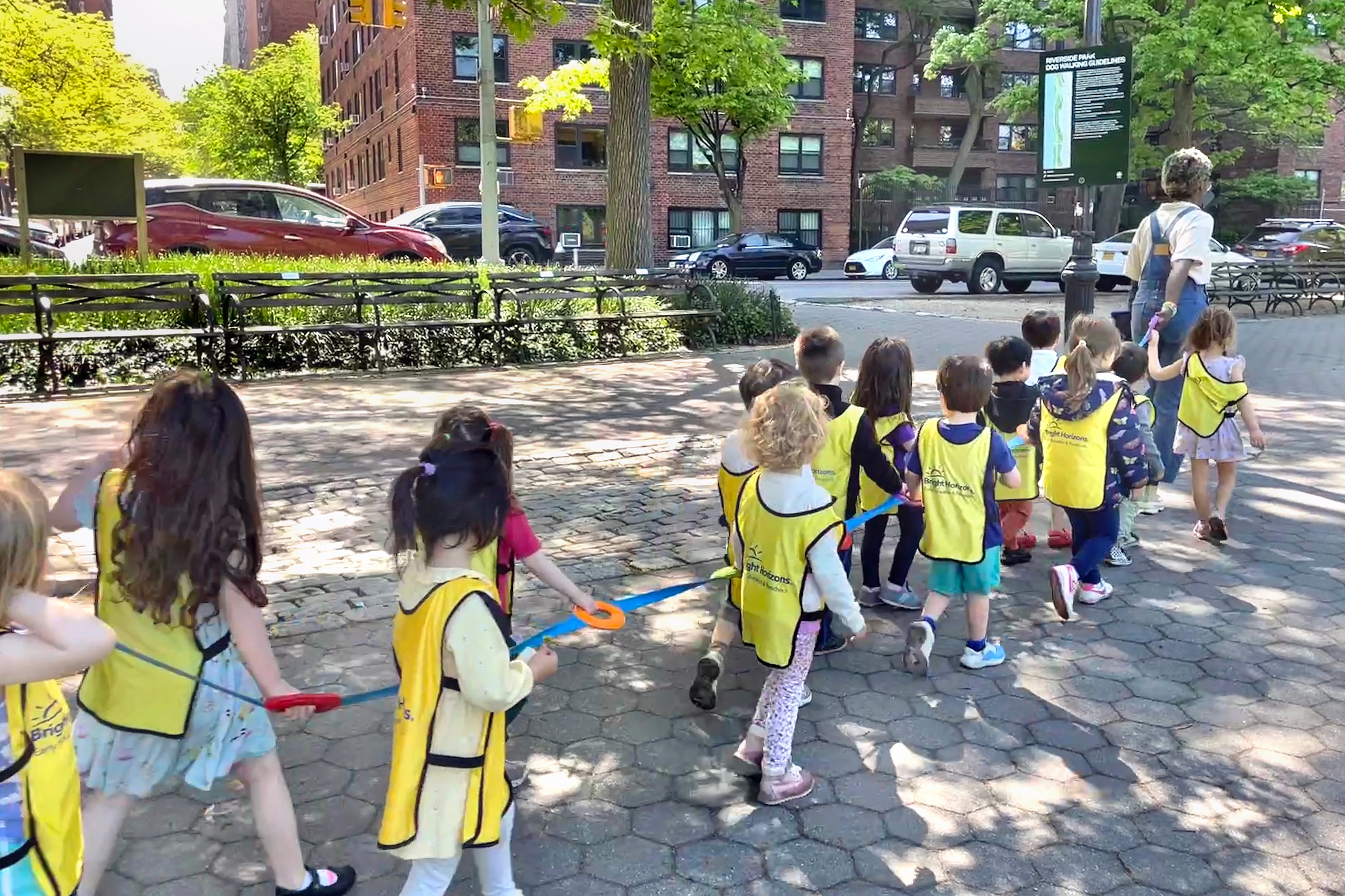 A photograph of Children walking with their daycare group in New York City.