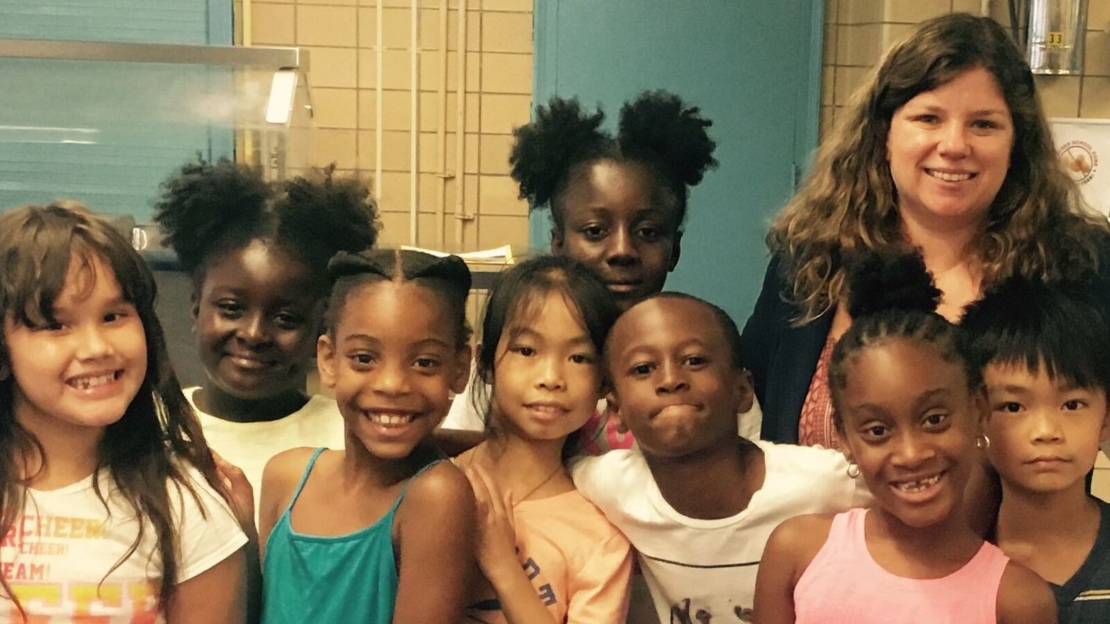 P.S. 191 Principal Lauren Keville with some of her students. The school was removed from the state's list of "persistently dangerous" schools.