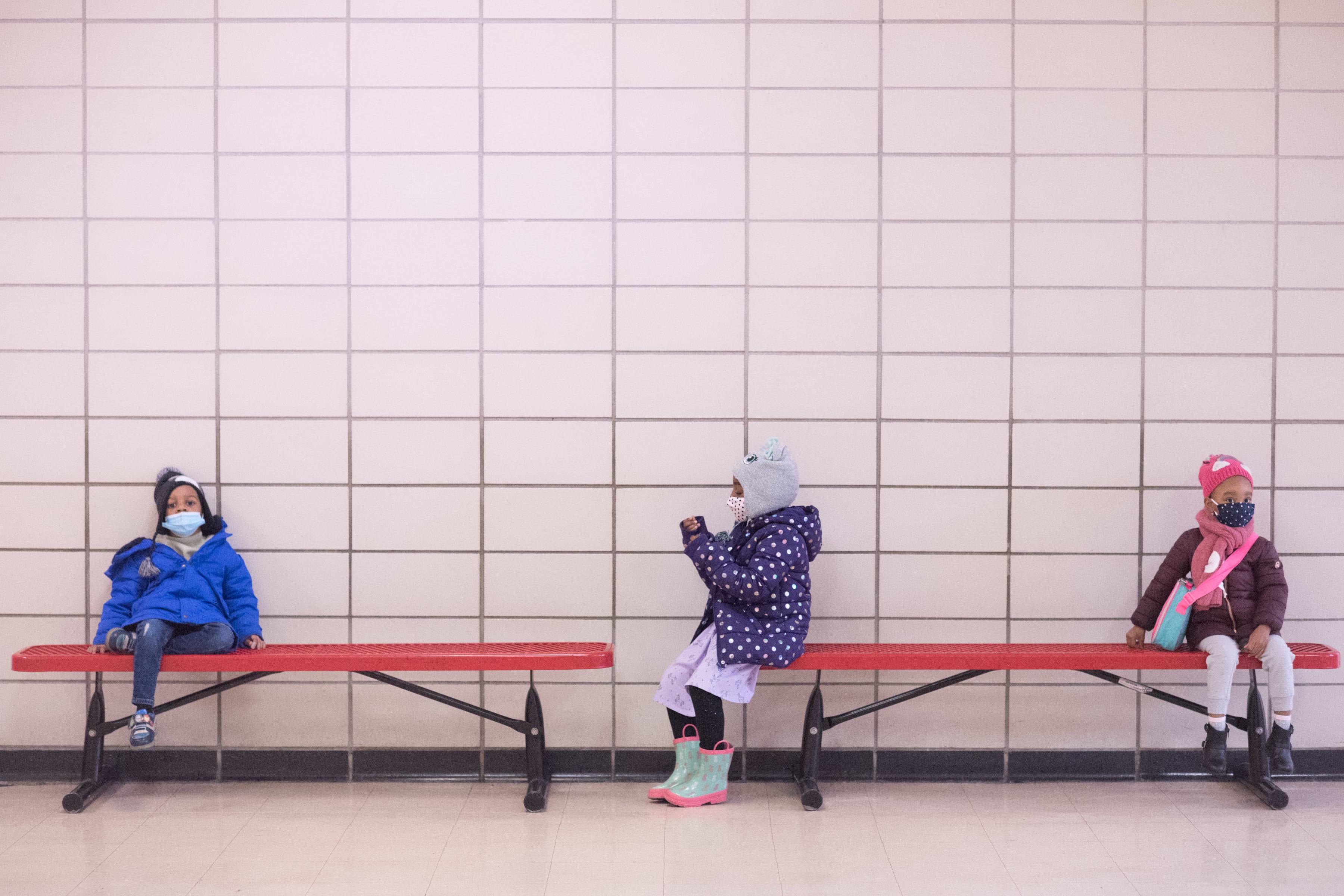 Preschool students sit on benches at Phyl’s Academy in Brooklyn in March 2021. Michael Appleton/Mayoral Photography Office