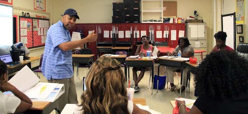 Principal Rodney Rowan works with reading teachers on instructional strategies they will use during the upcoming school year at Cherokee Elementary School, an iZone school in Memphis that posted big gains in its 2015 student test scores.