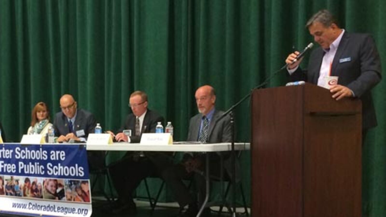 Moderator Jerry Healey (right) lays out ground rules before the Douglas County candidate forum.