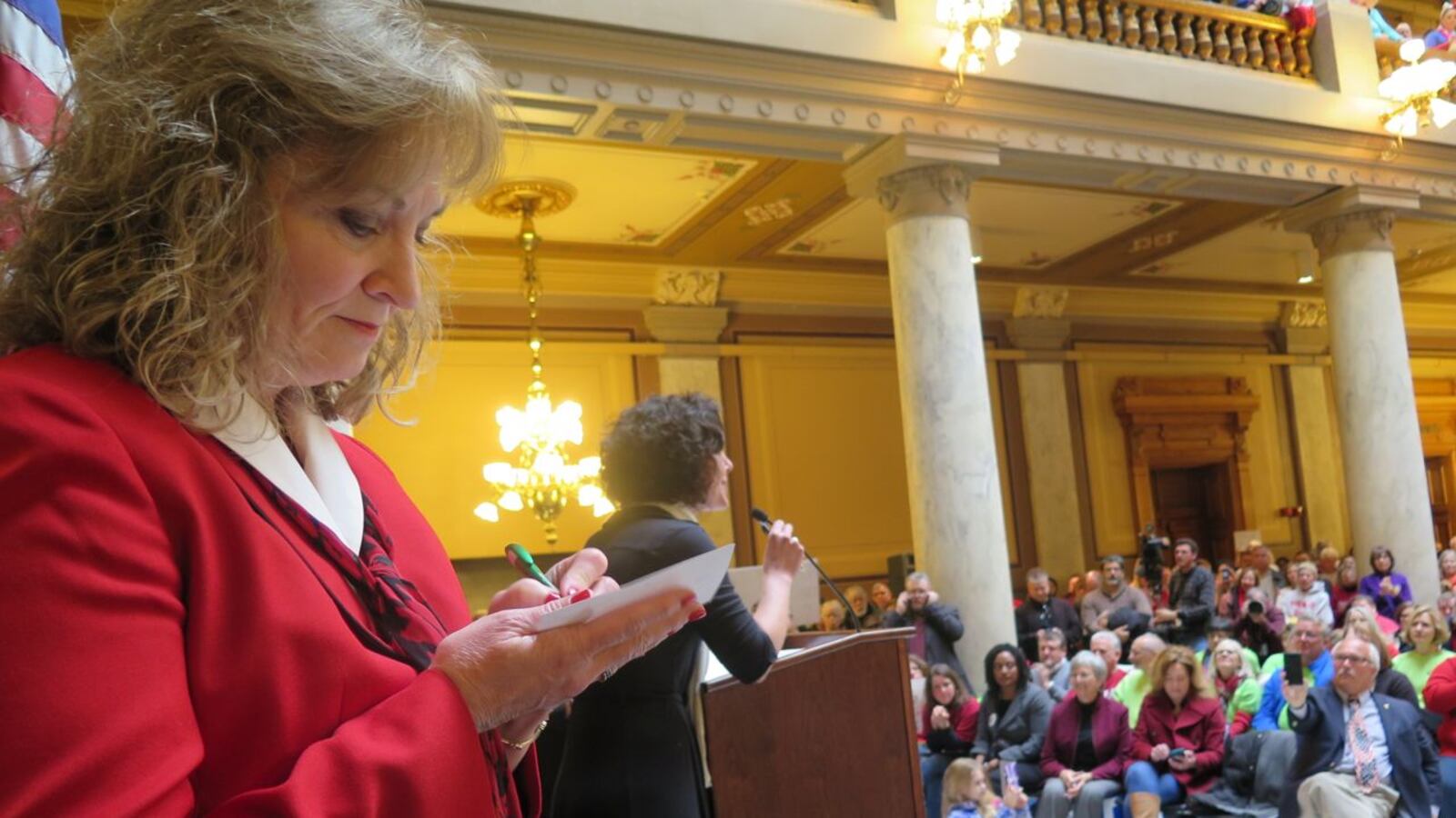 State Superintendent Glenda Ritz makes notes before speaking at a Rally to support her last February.