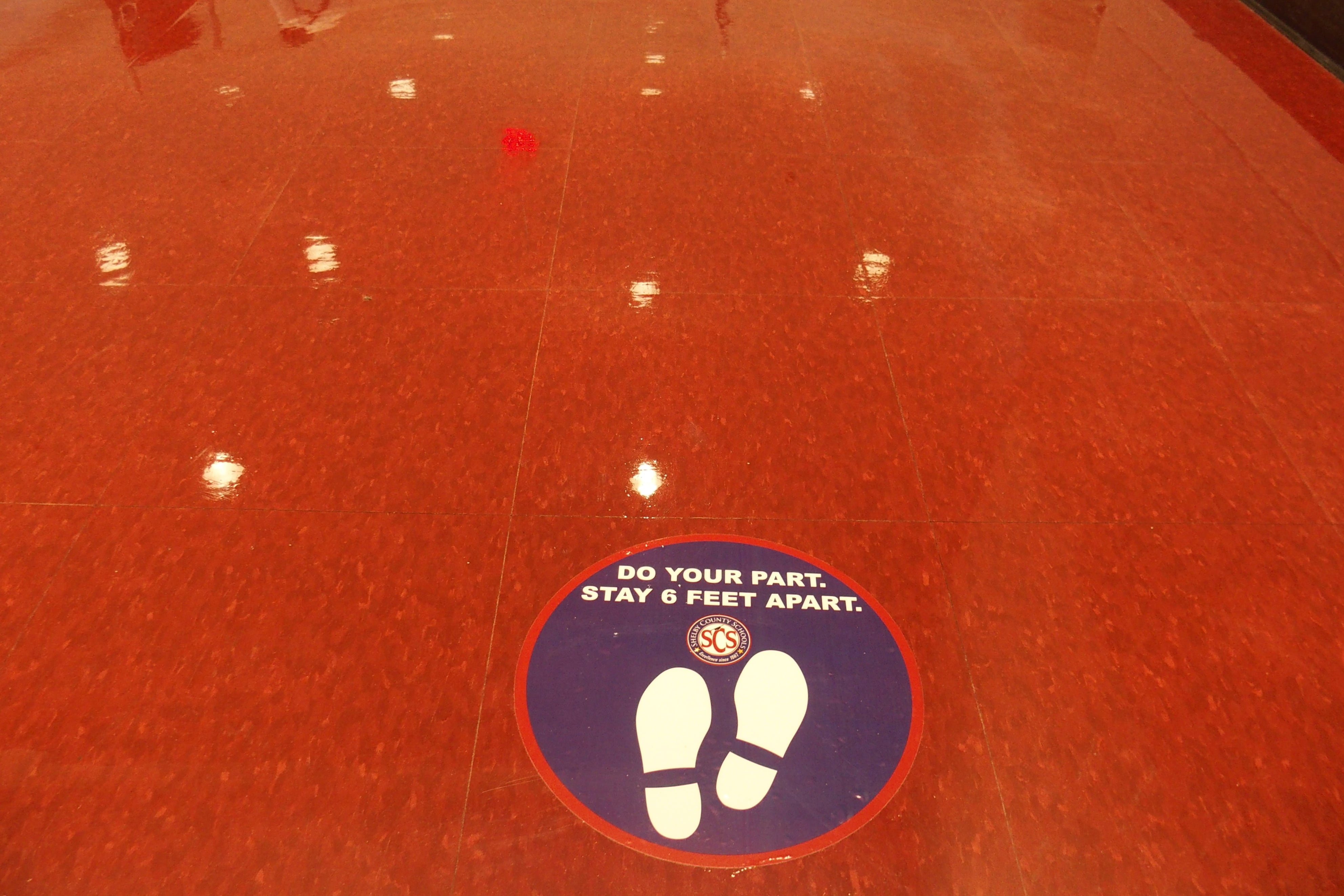 A social distancing floor marker in a Memphis school building