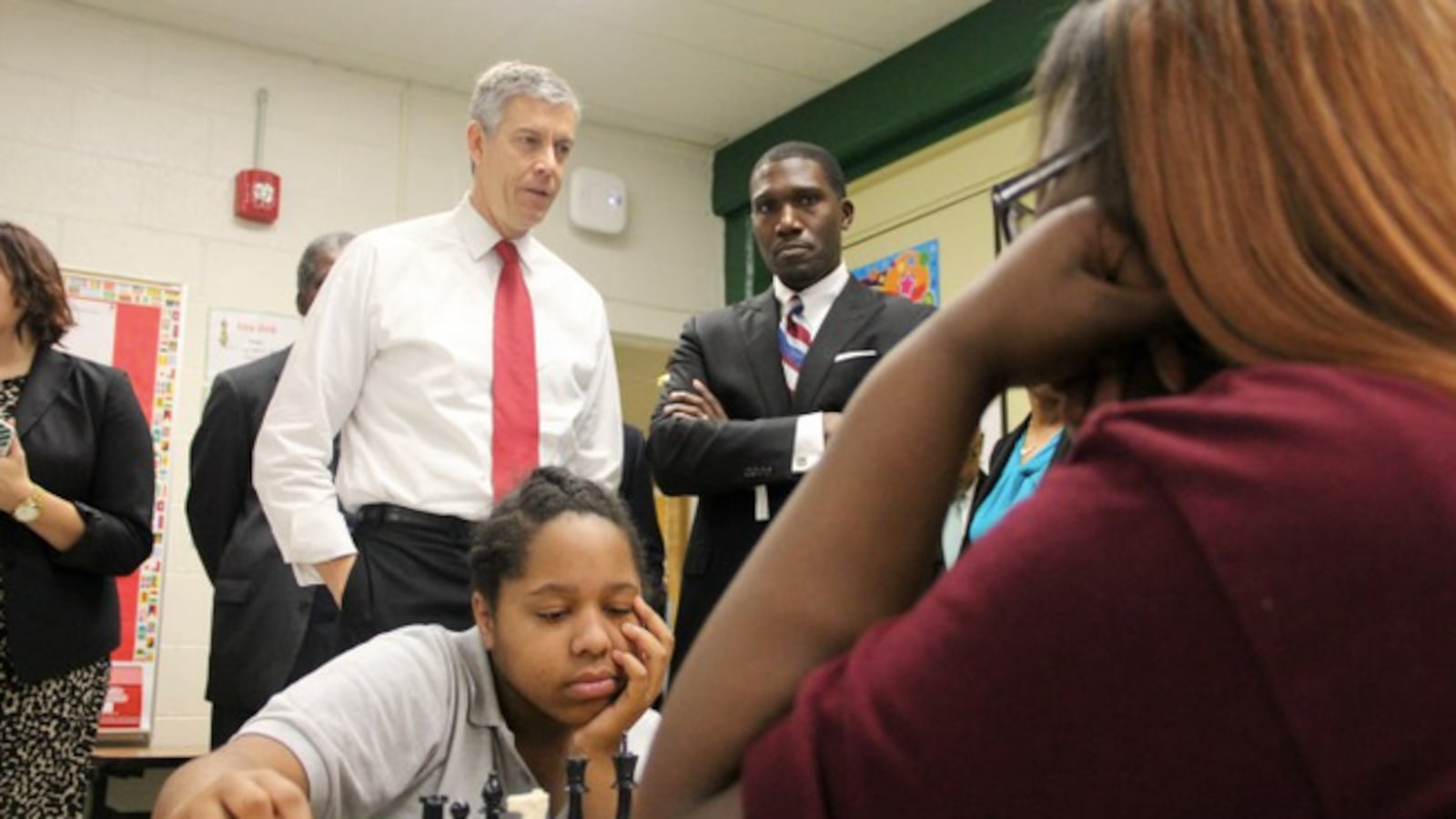 Then-U.S. Education Secretary Arne Duncan talks with students and their principal on a visit to Tennessee in October.