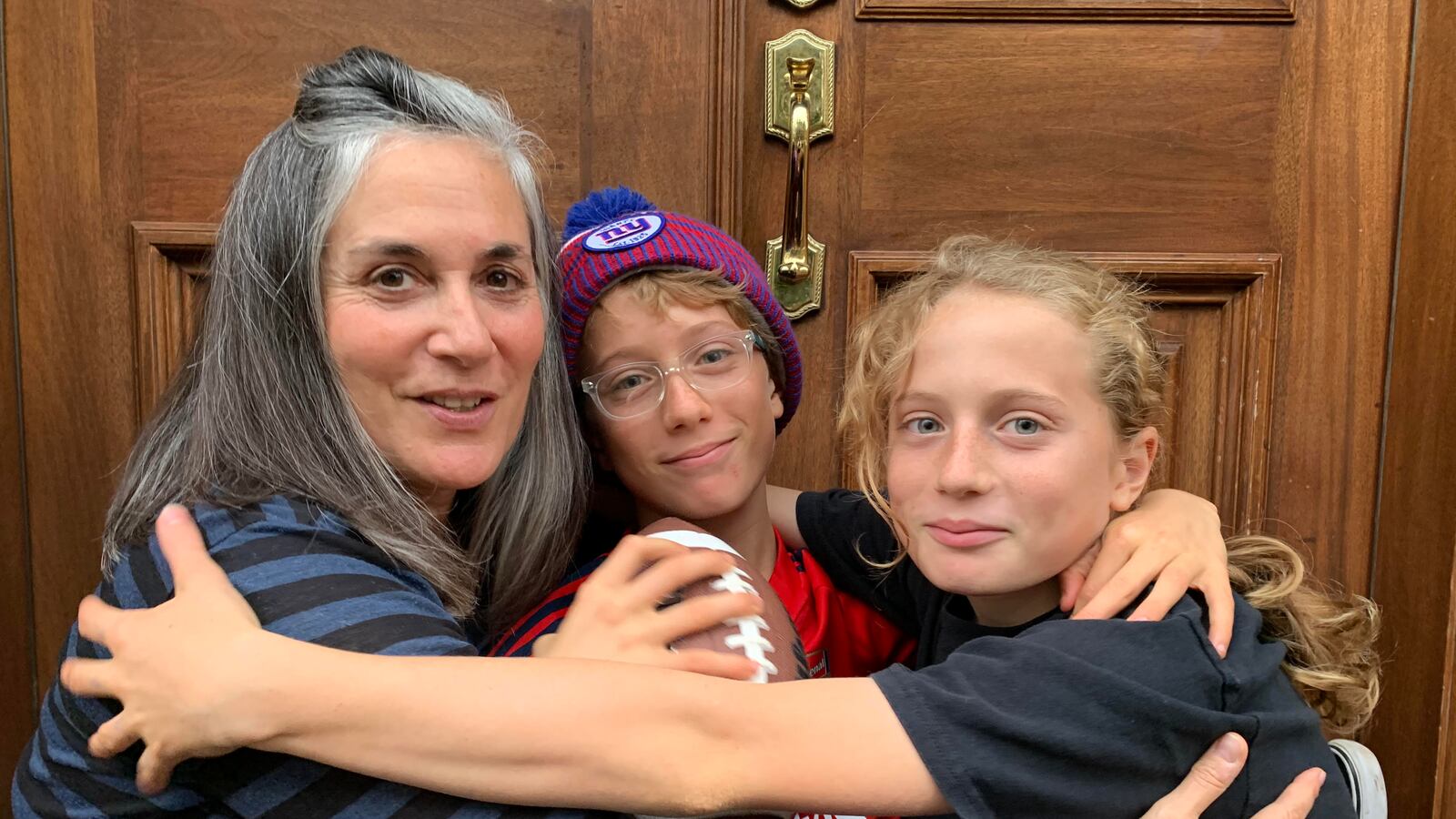 Mimi Turner's twin boys, Becket Tavenner (middle) and Dashiell Tavenner (right) were assigned to different middle schools this year. Parents in District 15 pressed the education department to change its admissions policies to allow twins to stay together at the same middle school.