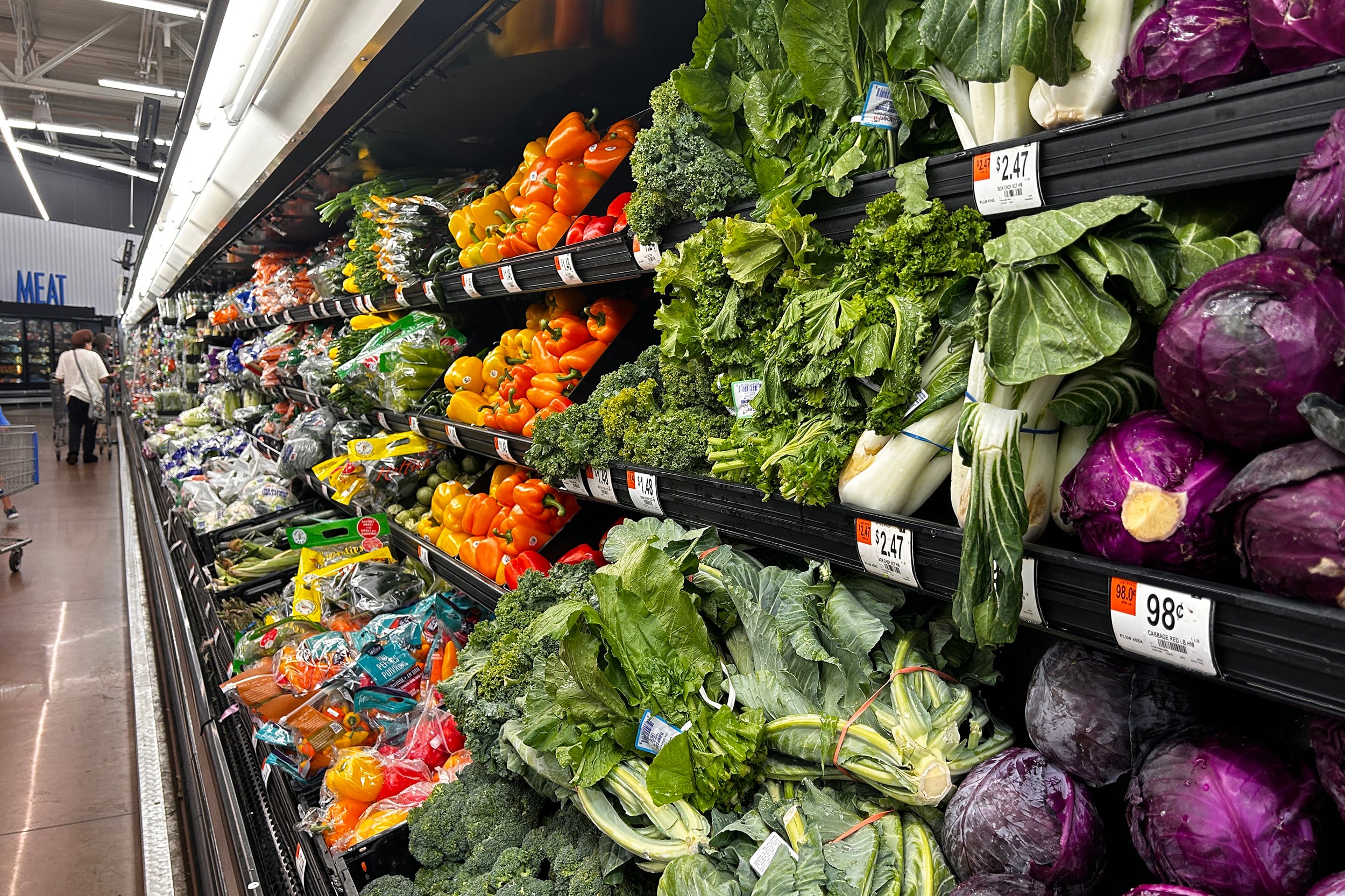 Walmart store interior of fresh fruits and the vegetable aisle.