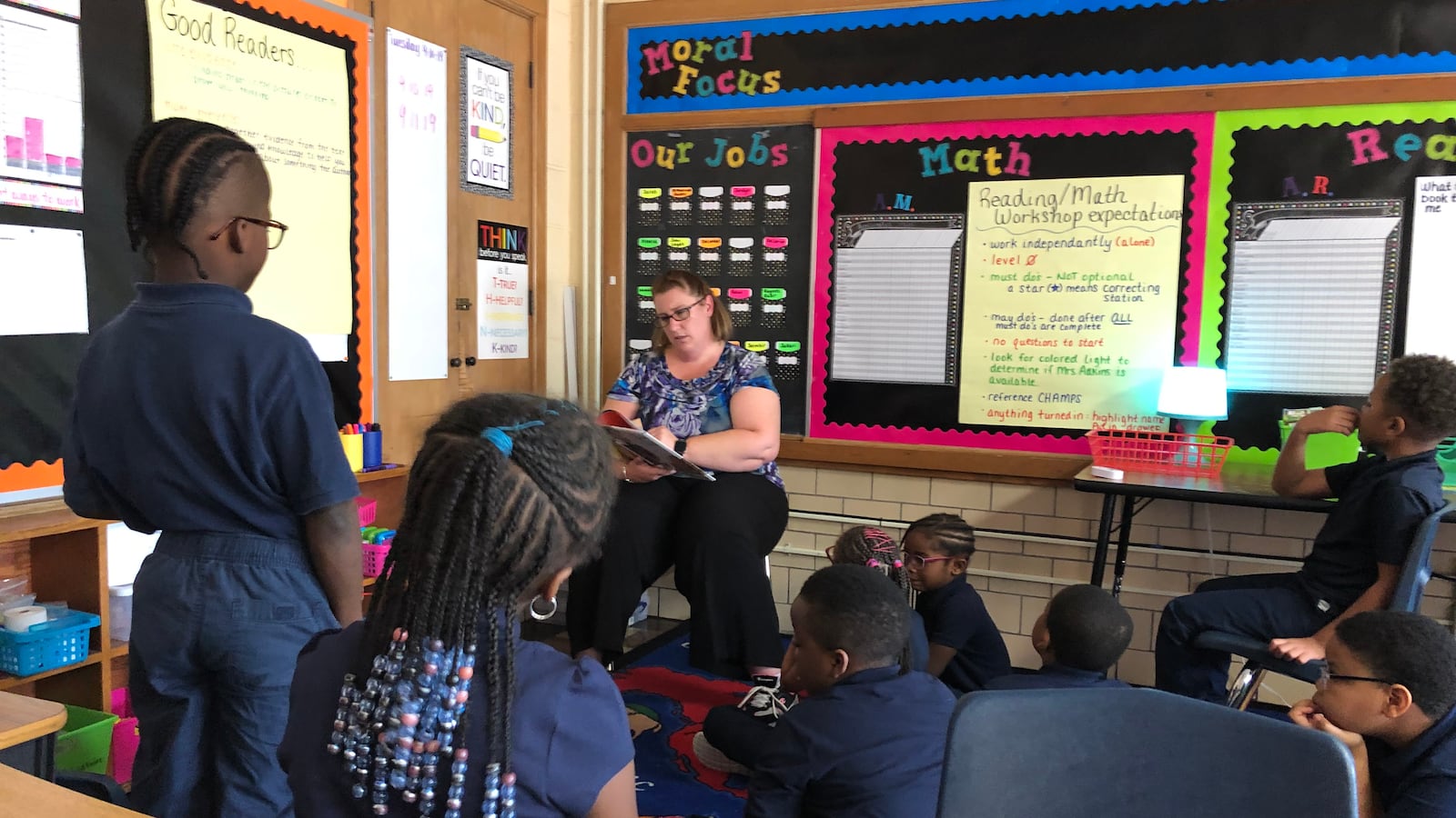Students in a classroom for advanced readers at Detroit Premier Academy listened to a teacher read a story that contained words like "thesaurus."