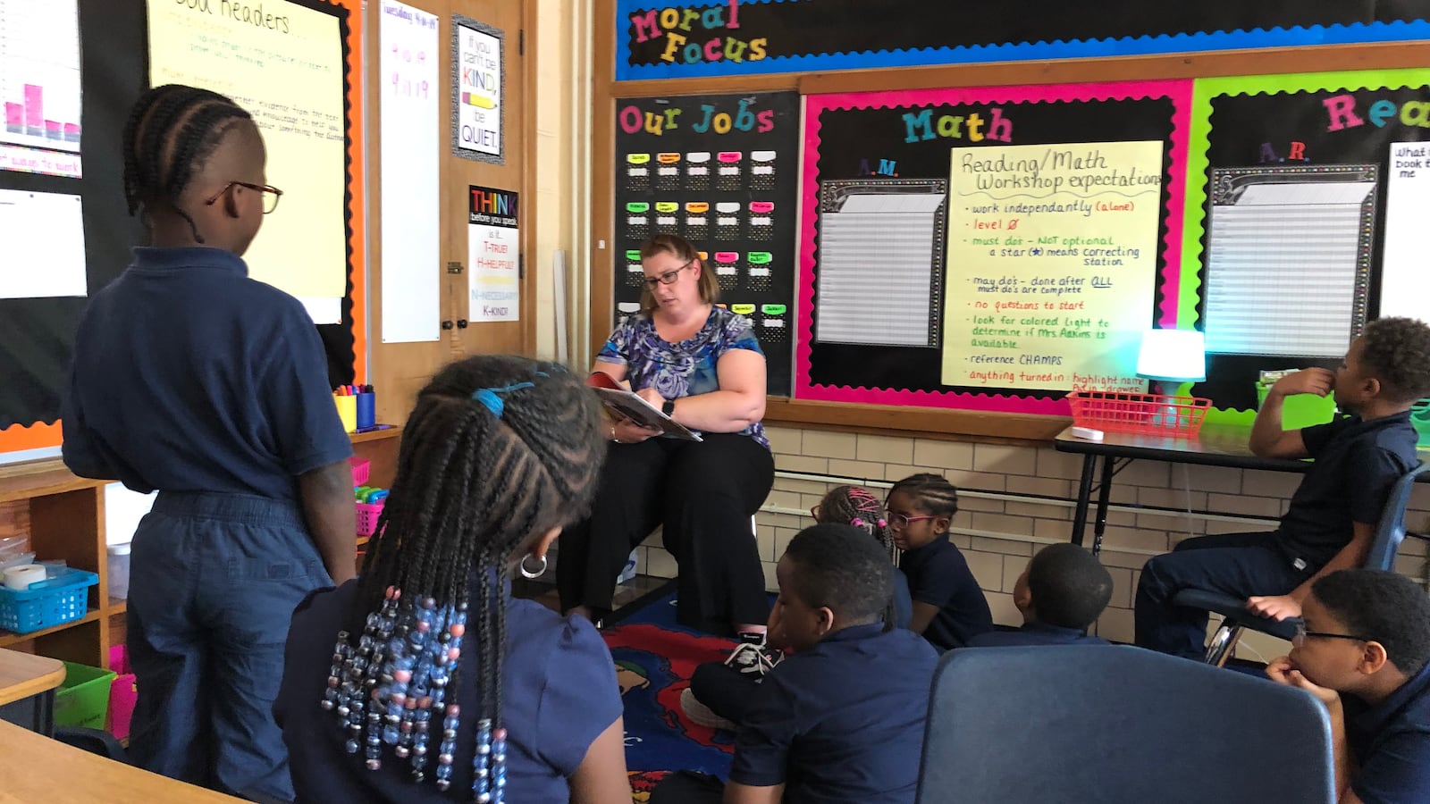 Students in a classroom for advanced readers at Detroit Premier Academy listened to a teacher read a story that contained words like "thesaurus."