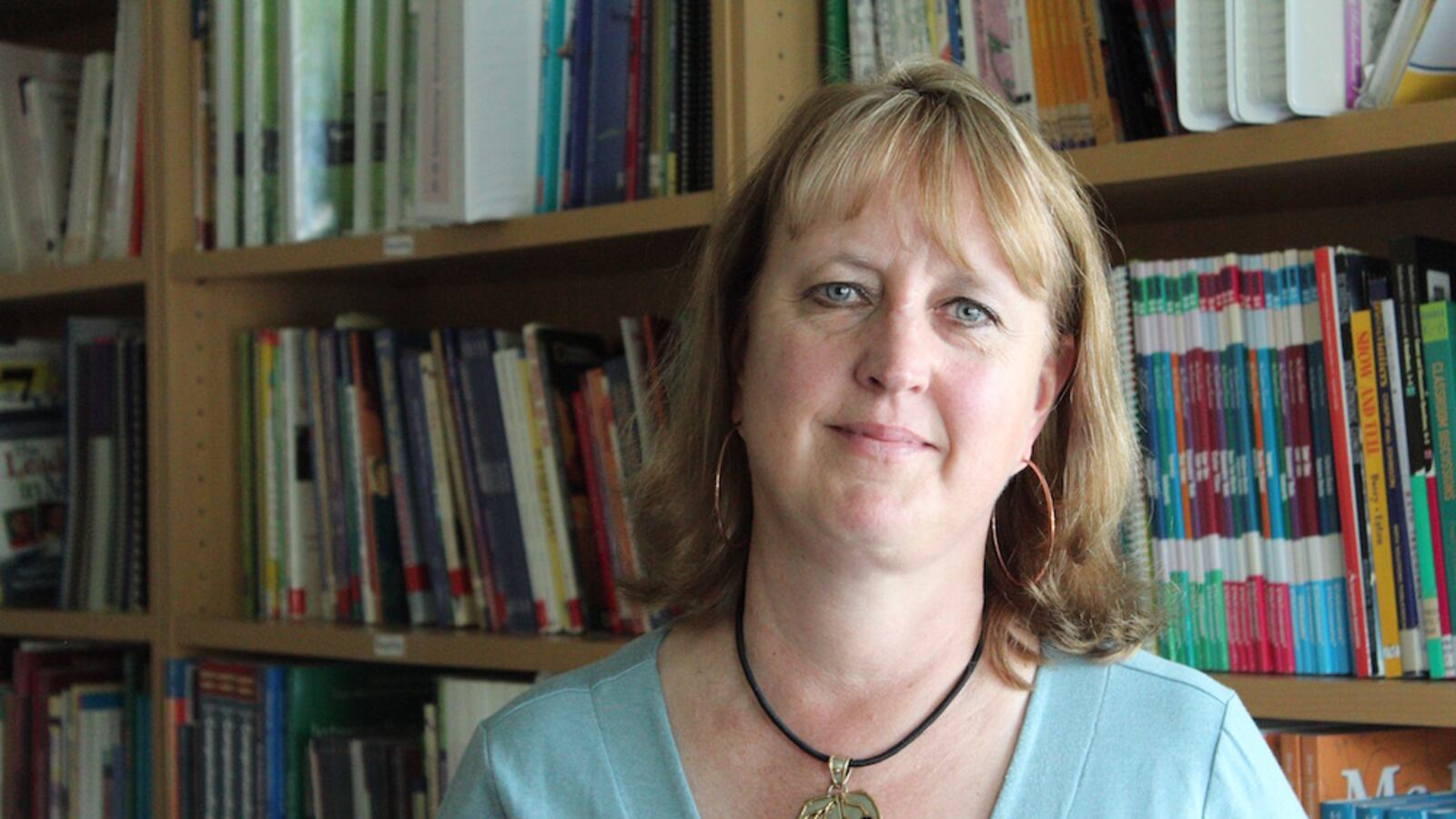 Jill Lliteras, a district veteran, has been charged with improving and closing a struggling Aurora elementary school to be handed over to a  charter school network.