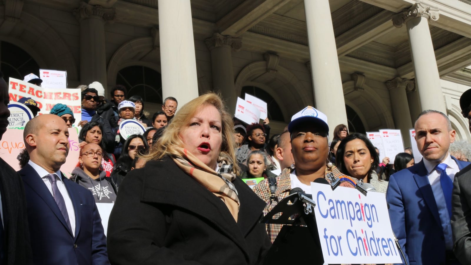 Kim Medina, the head of District Council 1707, speaks at a rally in March at City Hall to demand that pre-K teachers in community organizations are paid equally to education department teachers.