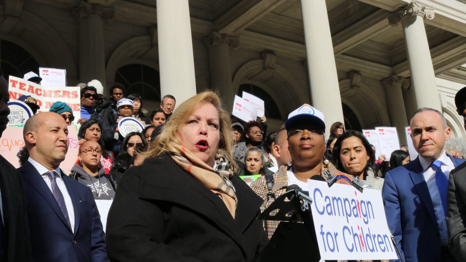 Kim Medina, the head of District Council 1707, speaks at a rally in March at City Hall to demand that pre-K teachers in community organizations are paid equally to education department teachers.