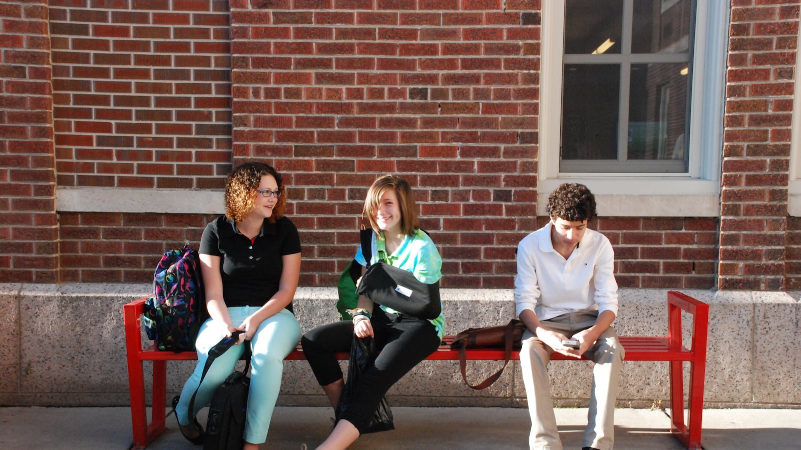 Freshman wait for school to start at DSST Cole High.