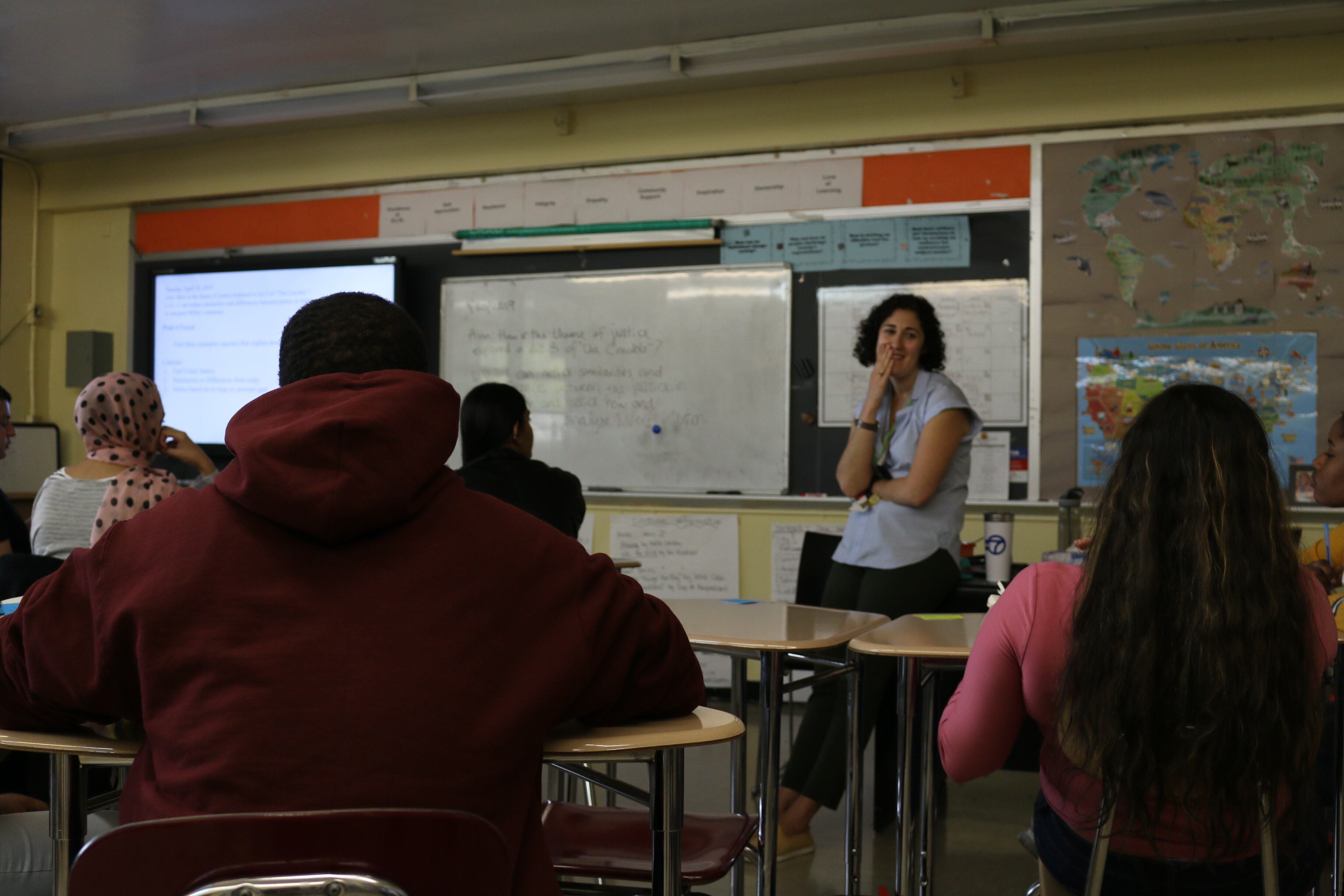 An English teacher chats about “The Crucible” with her class at ELLIS Prep Academy in the Bronx, a transfer school that serves immigrant students.