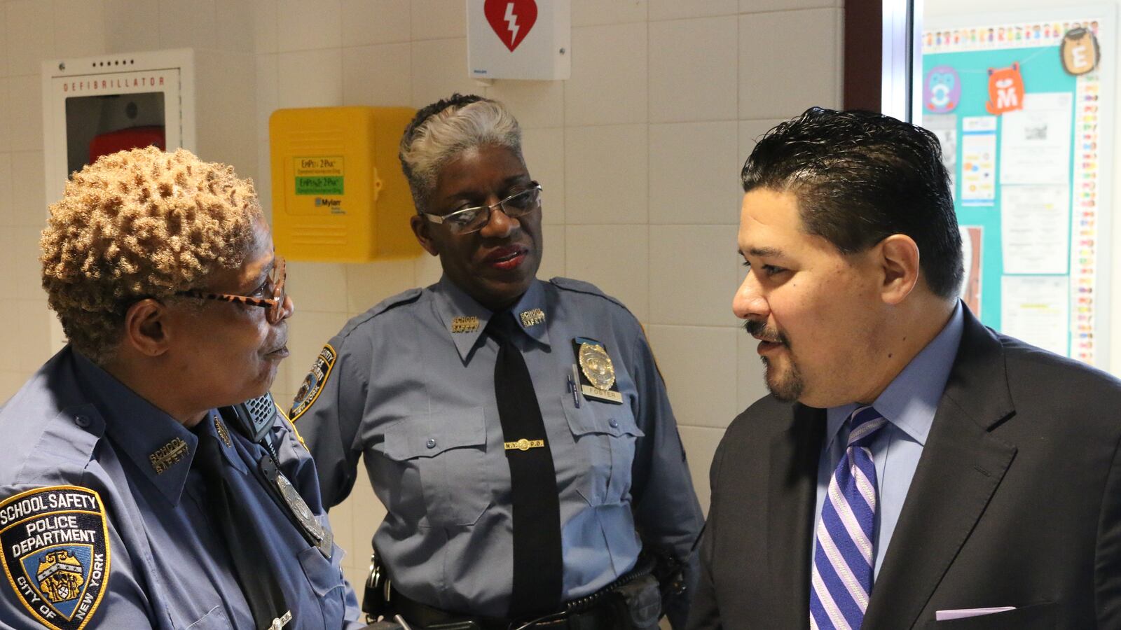 Schools Chancellor Richard Carranza chats with school safety agents on Staten Island.