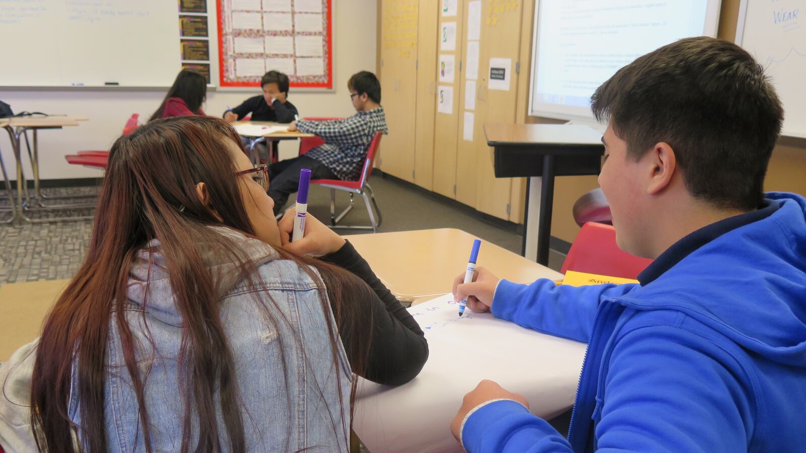 Two Southport High School students, Ting Ting (left) and Andre (right) are working on an activity in Amy Peddie’s level 3 English-learner class. Ting Ting is originally from Burma, and Andre moved from Brazil.